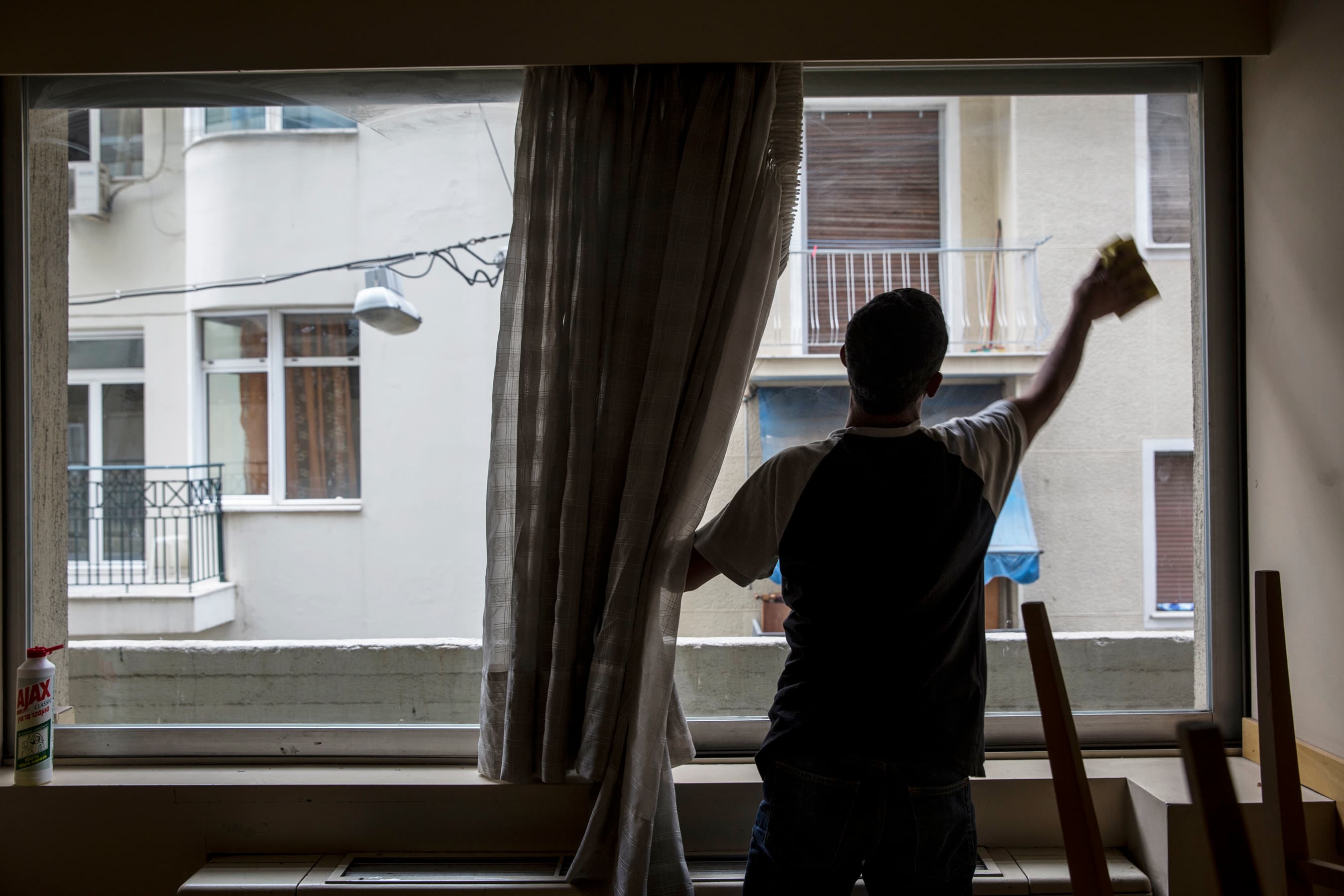 Refugees share in cleaning and maintaining the City Plaza Hotel