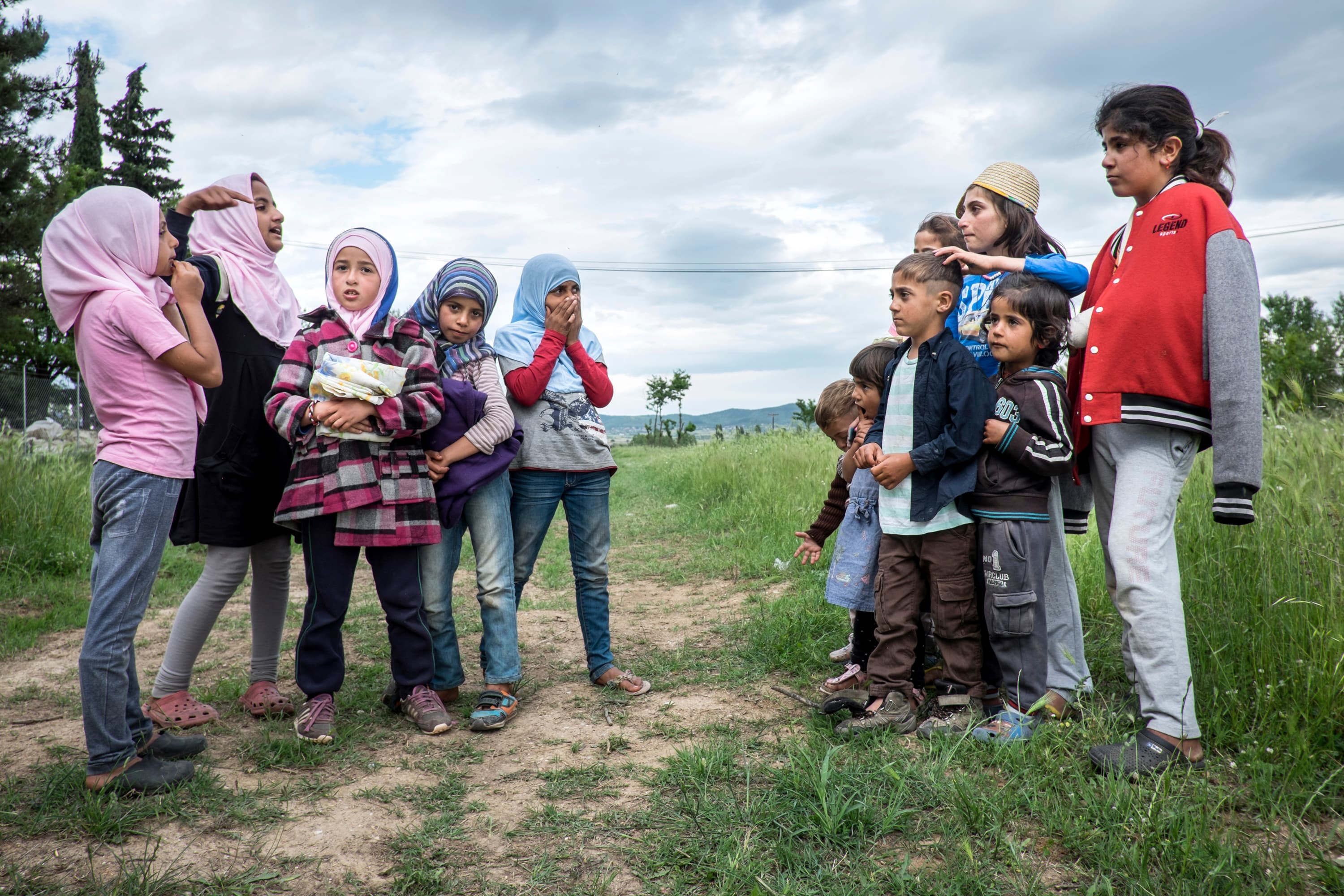 Girls outside Cherso Camp in northern Greece