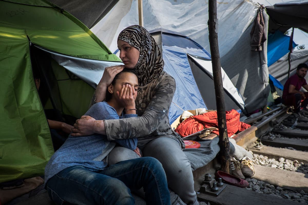 Leen Issa comforts her daughter, 11-year-old Rezan, who was suffering from the effects of tear gas exposure from clashes the previous night. Rezan had open heart surgery as a baby and still suffers from a heart condition. The family from Syria lives in te