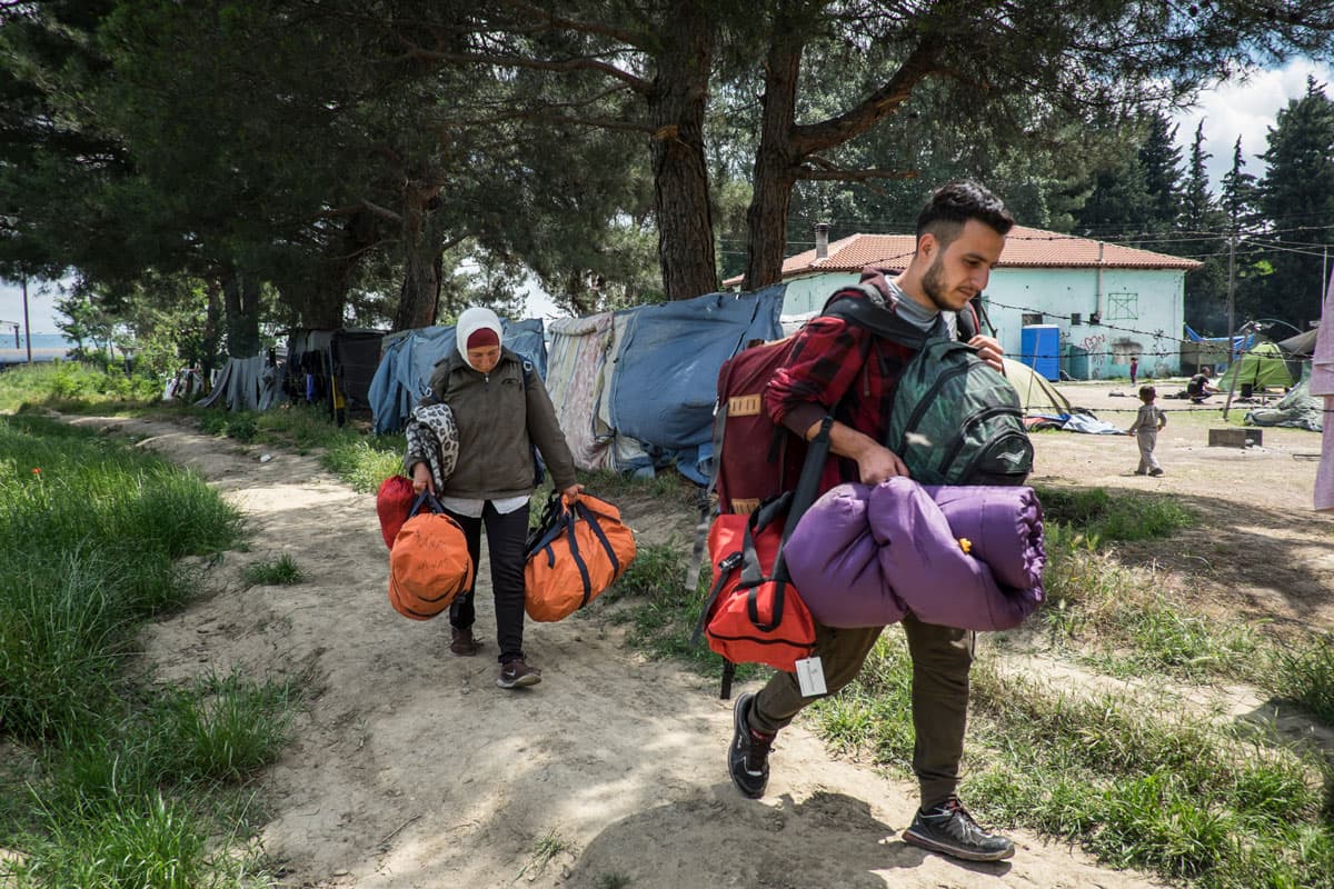 Anas Nashwati, 22, and his mother, Maryam Boura, leaving Idomeni for a new camp near Thessaloniki, the day after clashes between immigrants and Greek police ended in tear gas. The family (of three, including his sister, 16) were living aboard a train park