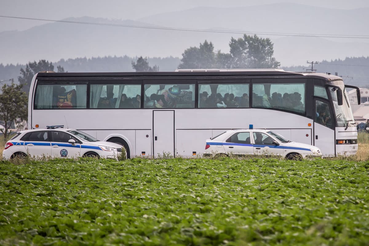 Police escort a bus from Idomeni Camp during operations to evacuate approximately 8,500 immigrants and refugees, many of whom have been there since March.