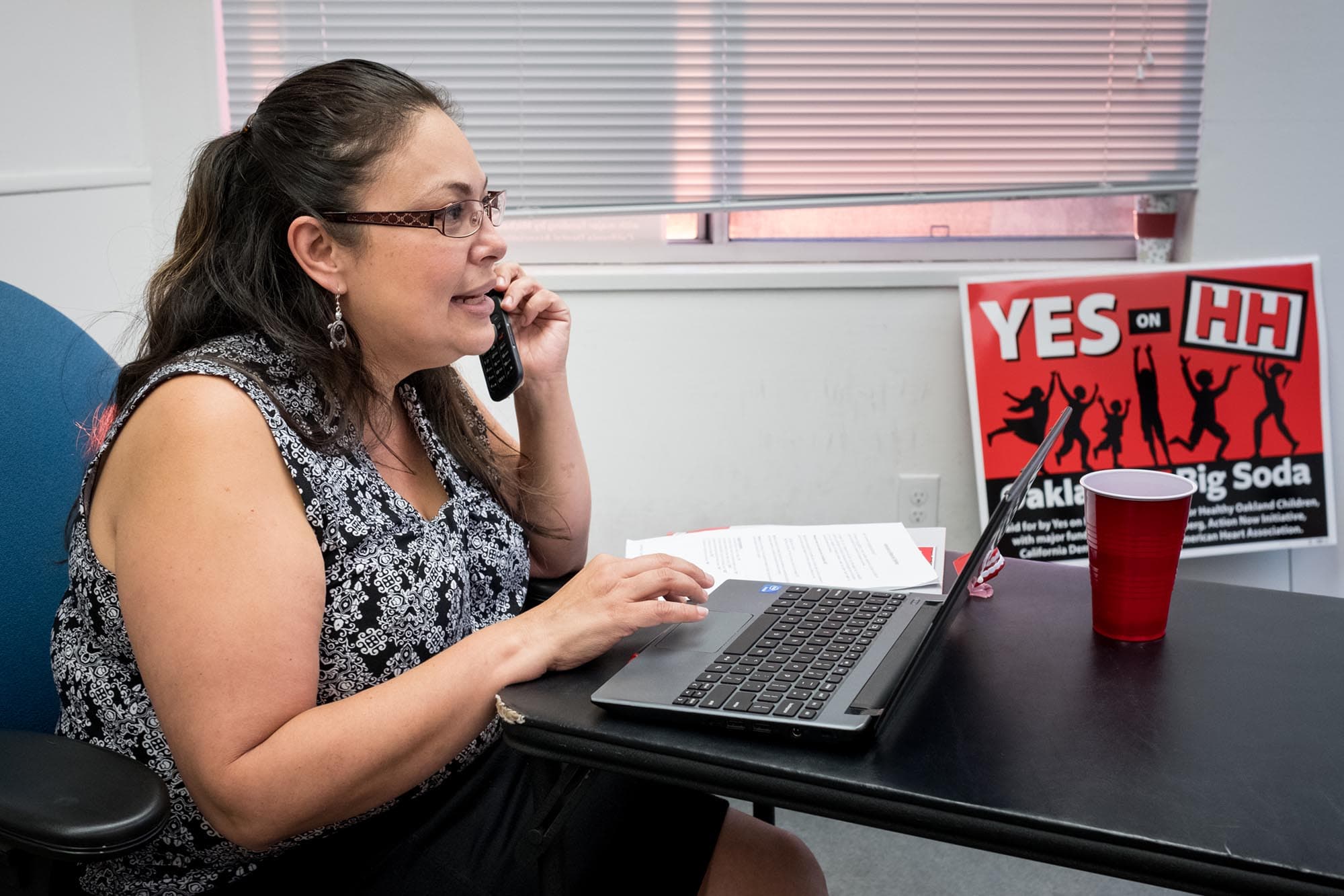 At the Oakland vs. Big Soda campaign office, Claudia Rodriguez-Briones calls Spanish-speaking voters.