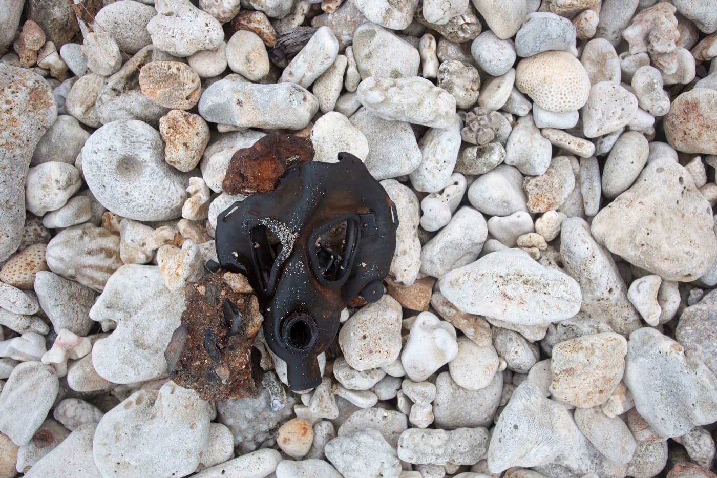 A gas mask from the era of U.S. nuclear testing resurfaced on the beach of Enewetak after Typhoon Bavi’s storm surge and winds.