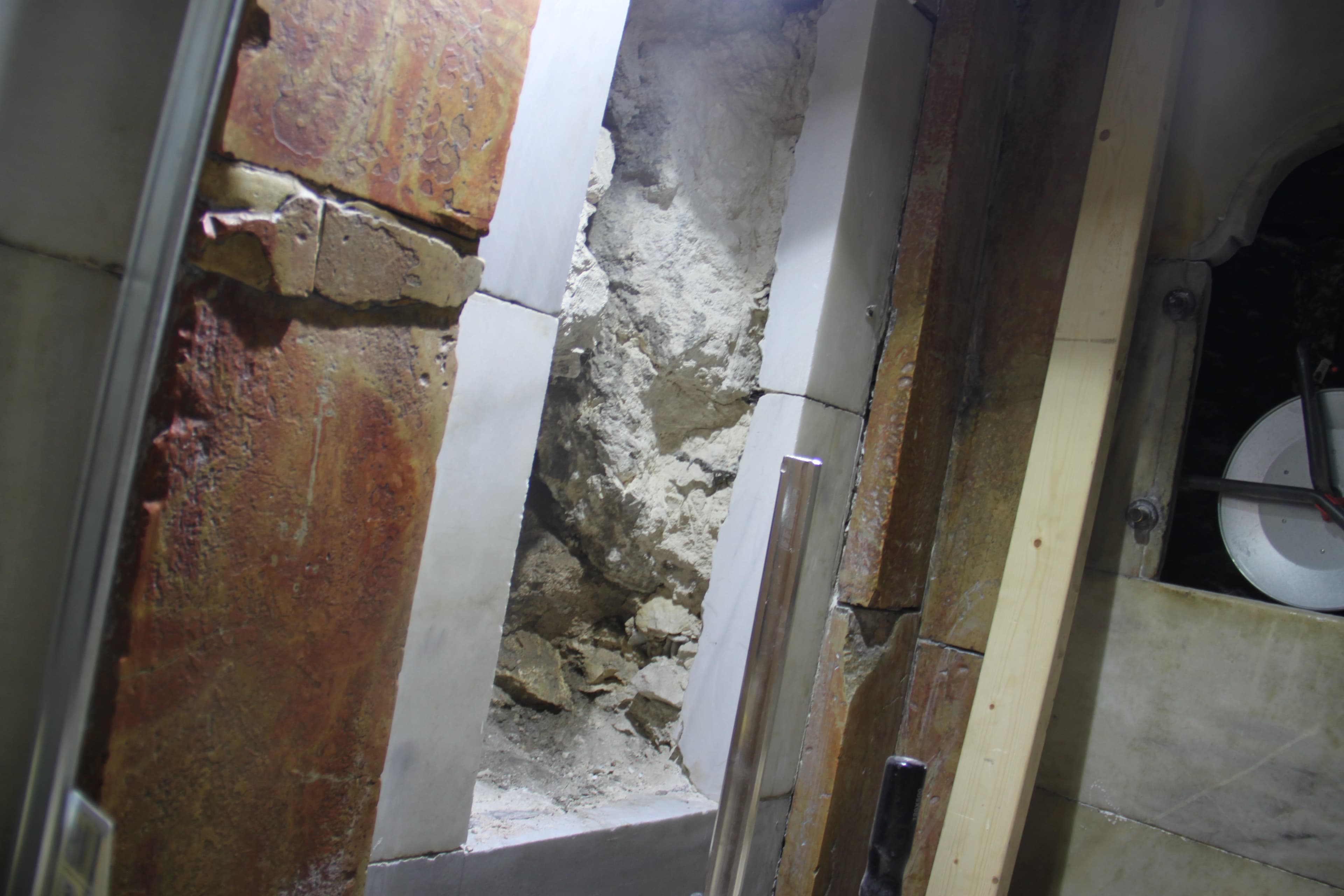 The restoration team cut a hole into one of the marble encasings so for the first time, pilgrims will see the limestone wall of what’s revered as Jesus’ tomb.