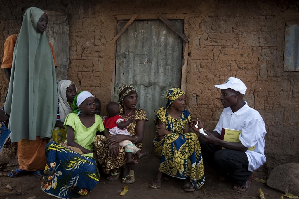 An anti-drug vigilante group called Patjasan speeds towards the home of a suspected meth user in Myitkyina, Myanmar.