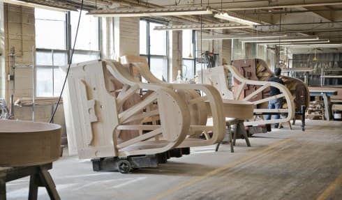 Pianos rest in the Case Department of the Steinway piano factory in Astoria, Queens, awaiting finishing. Once each is complete, it will have its own, specific sound.
