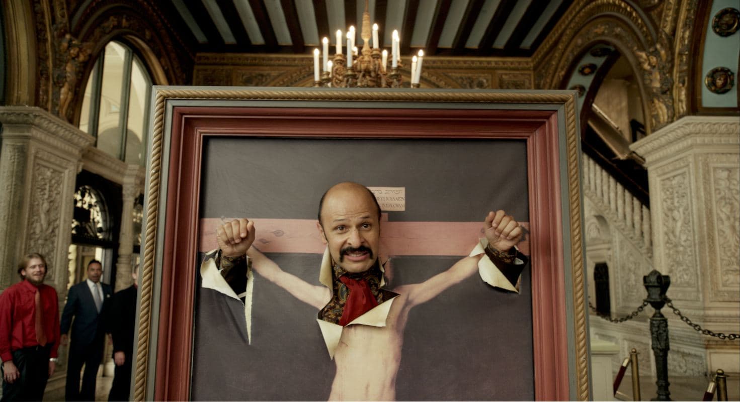 Jimmy Vestvood poking through framed picture