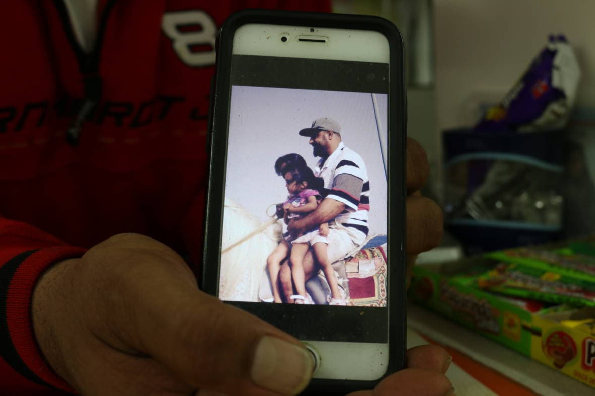 Saber Askar riding a horse with his two youngest daughters near the Red Sea in Yemen