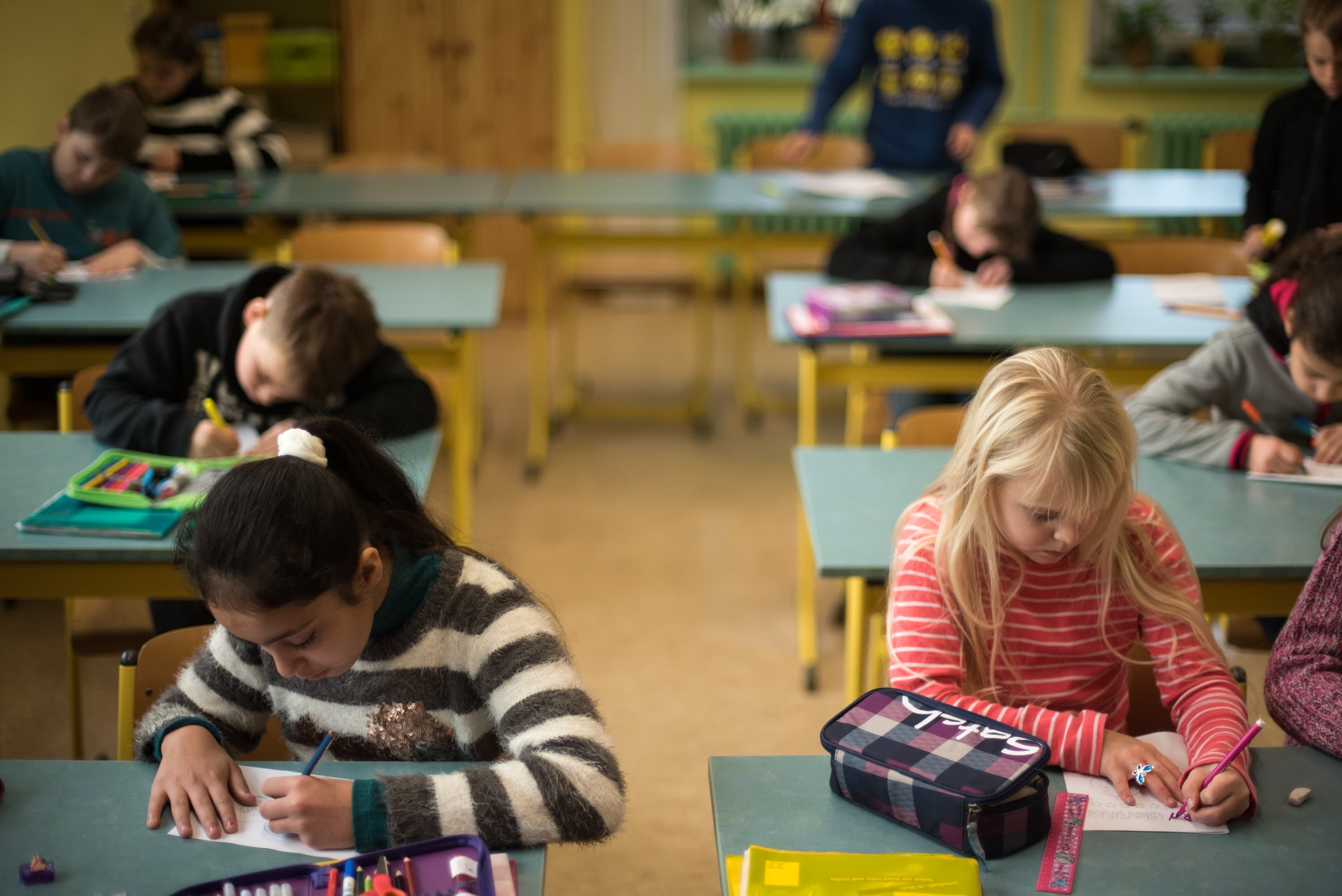 Students work on an assignment at the elementary school in Golzow.
