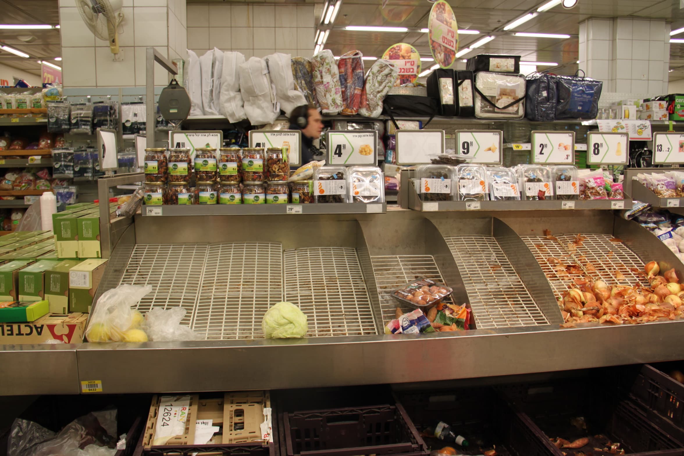 Slim pickings at a Jerusalem supermarket after shoppers stocked up on provisions for the predicted snowstorm.