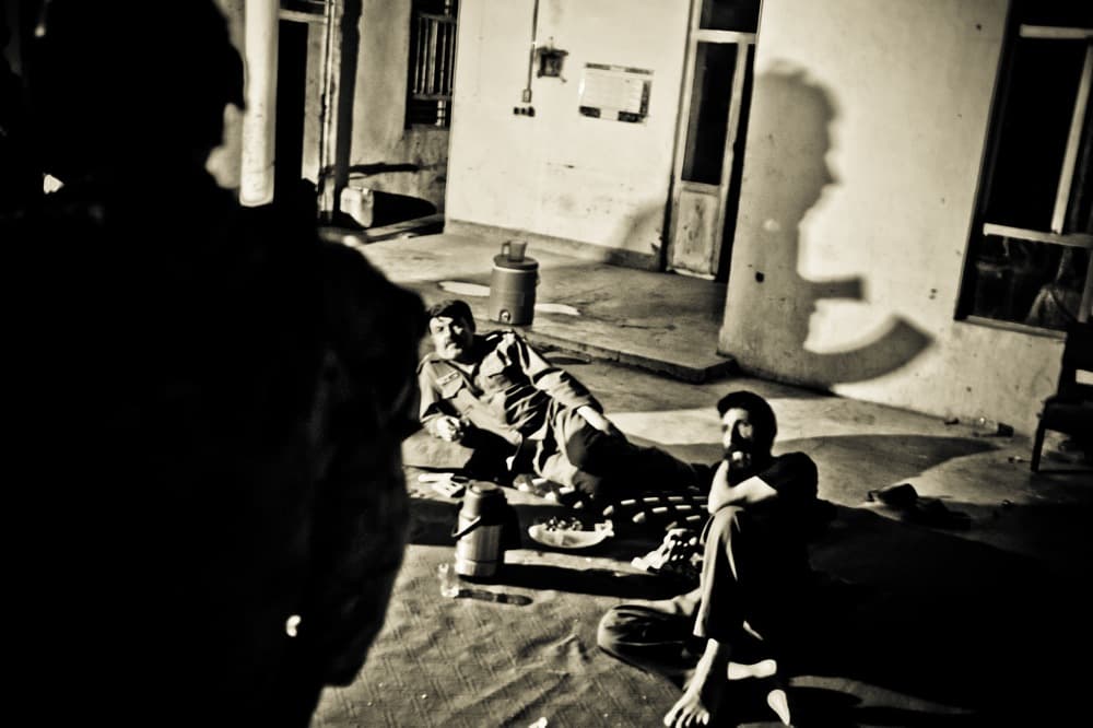 An officer with Thailand's 327th Thai Border Police Company in Chiang Rai province crouches along a jungle path favored by meth smugglers from Myanmar. Drug traffickers allied to Myanmar militias are often heavily armed with assault rifles and grenades.