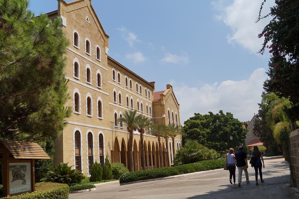 Buildings with people walking in front