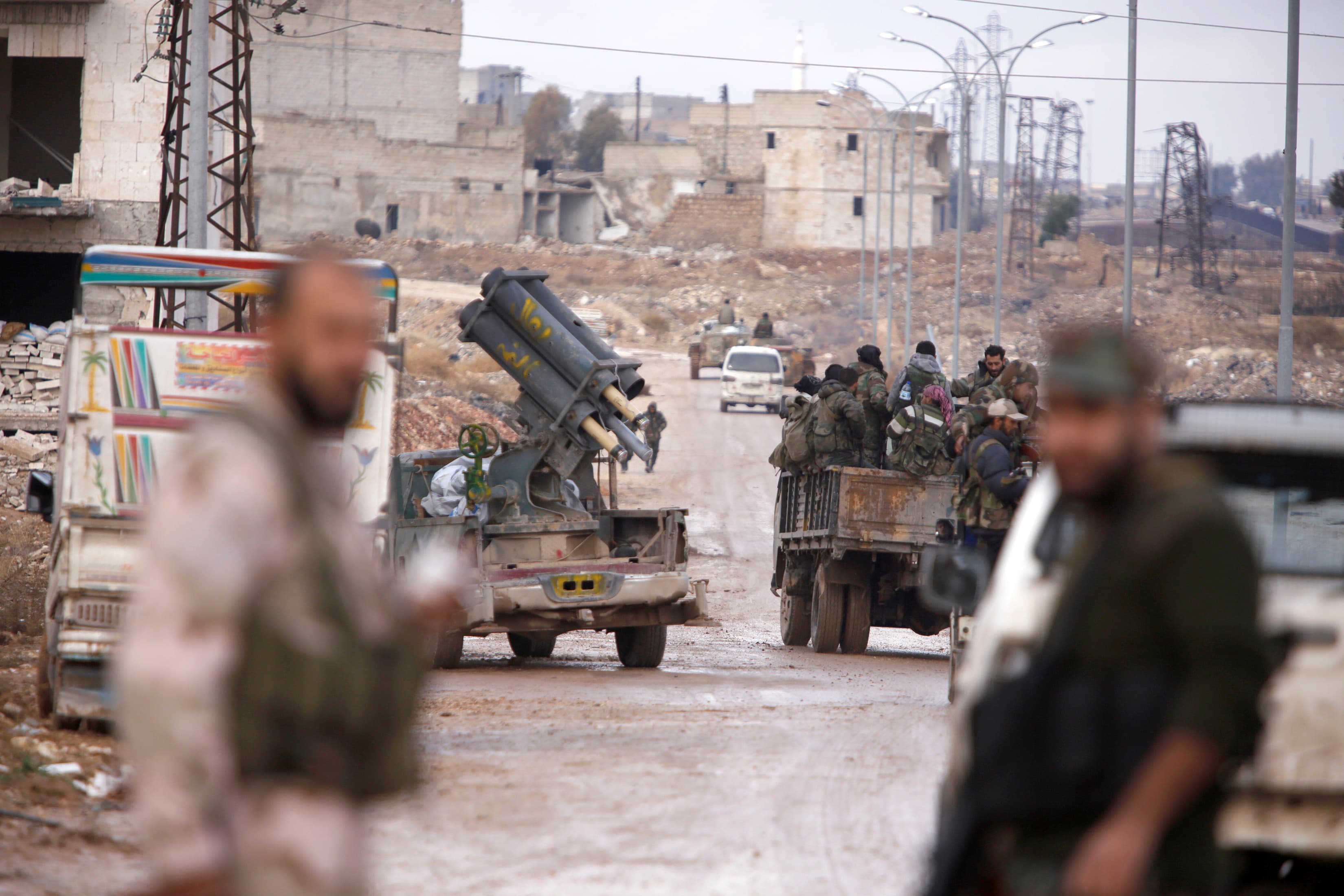 Syrian government soldiers gather in Al-Haidariya neighborhood after government forces took control of the area in Aleppo, December 2.