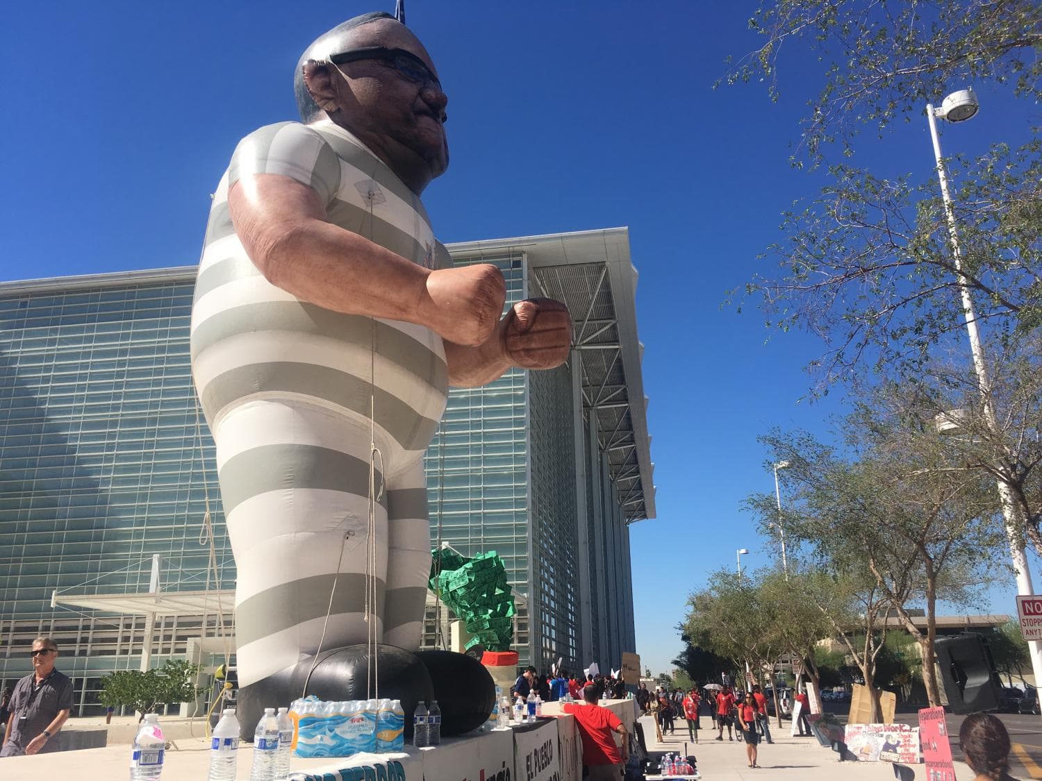 protesters around large balloon of prisoner