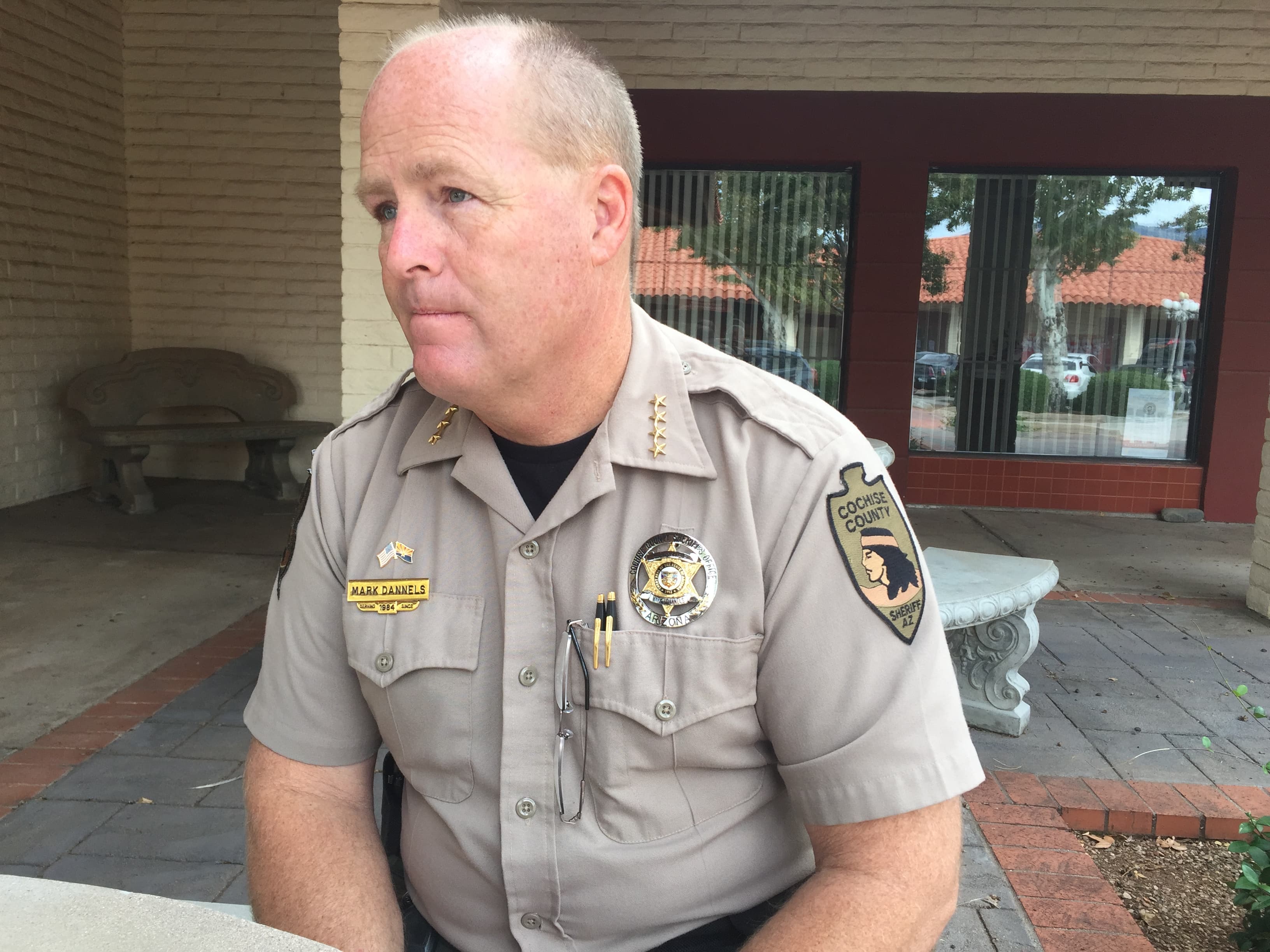 portrait of man sitting at table, talking