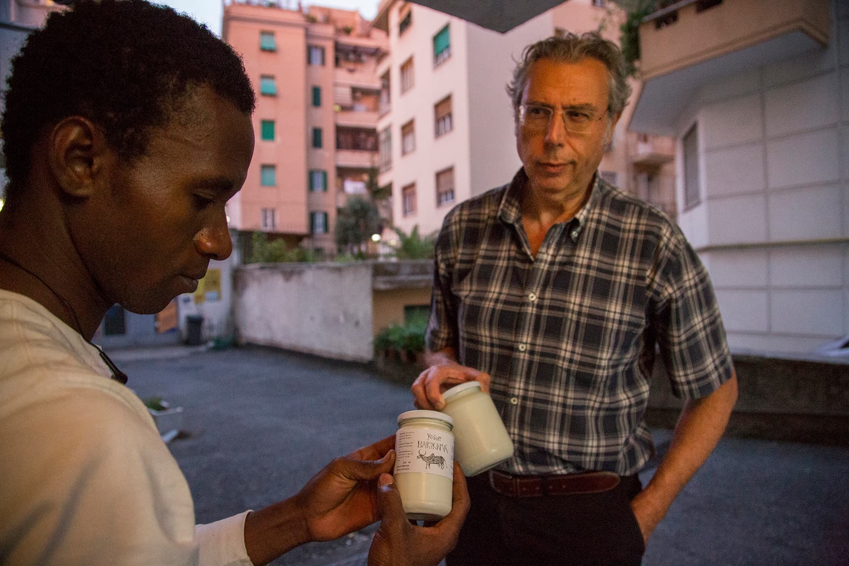 Seydou places a Barikama label on a jar of yogurt before selling it.  The company logo features a typical African cow with a hump.  It’s become an image that many Roman circles admire and expect.