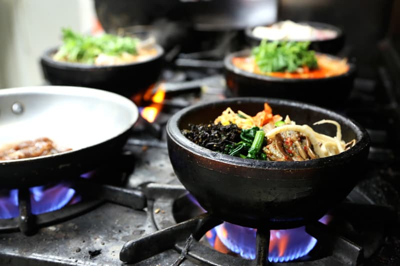 Many of the Korean dishes at Koreana are cooked and served in a hot stone bowl. Hyosun Tartaglia says her military customers who've served in Korea can handle her spiciest dishes.
