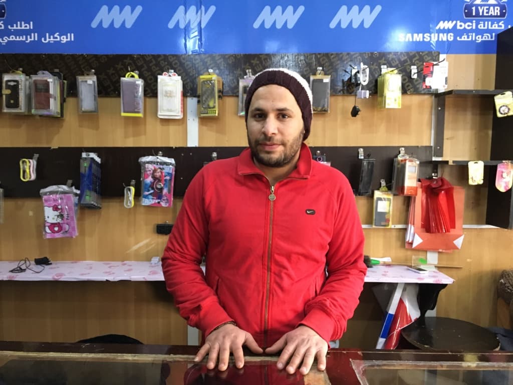 Abdel Naser Hamada studied engineering back in Syria. Now, he runs a cell phone shop in the Zaatari refugee camp in Jordan.