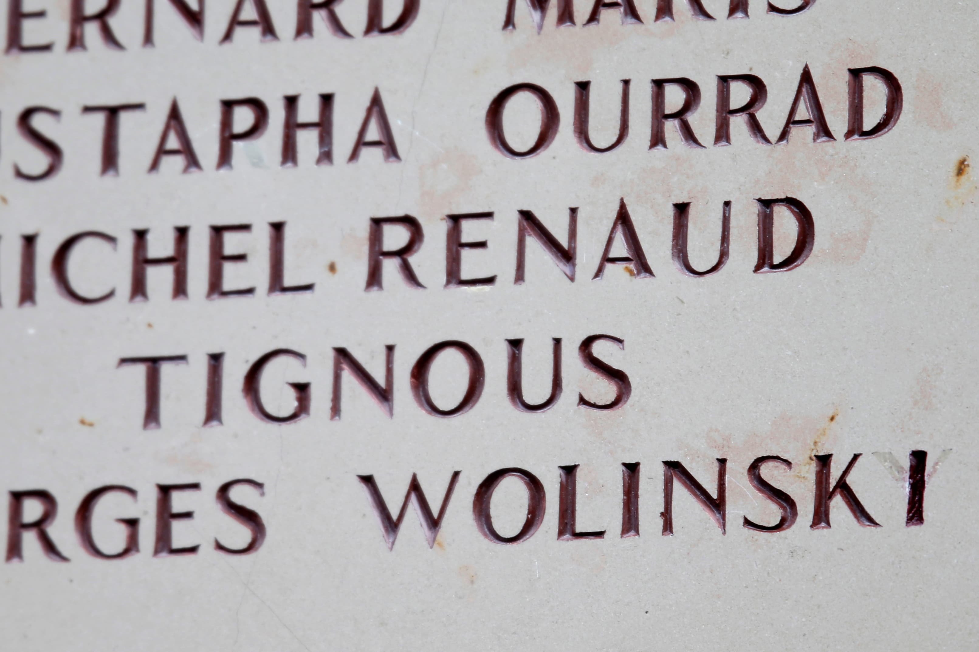 The name of cartoonist Wolinski is seen after the spelling was corrected on a commemorative plaque to pay tribute to the victims of the attacks outside the former offices of French weekly satirical newspaper Charlie Hebdo.