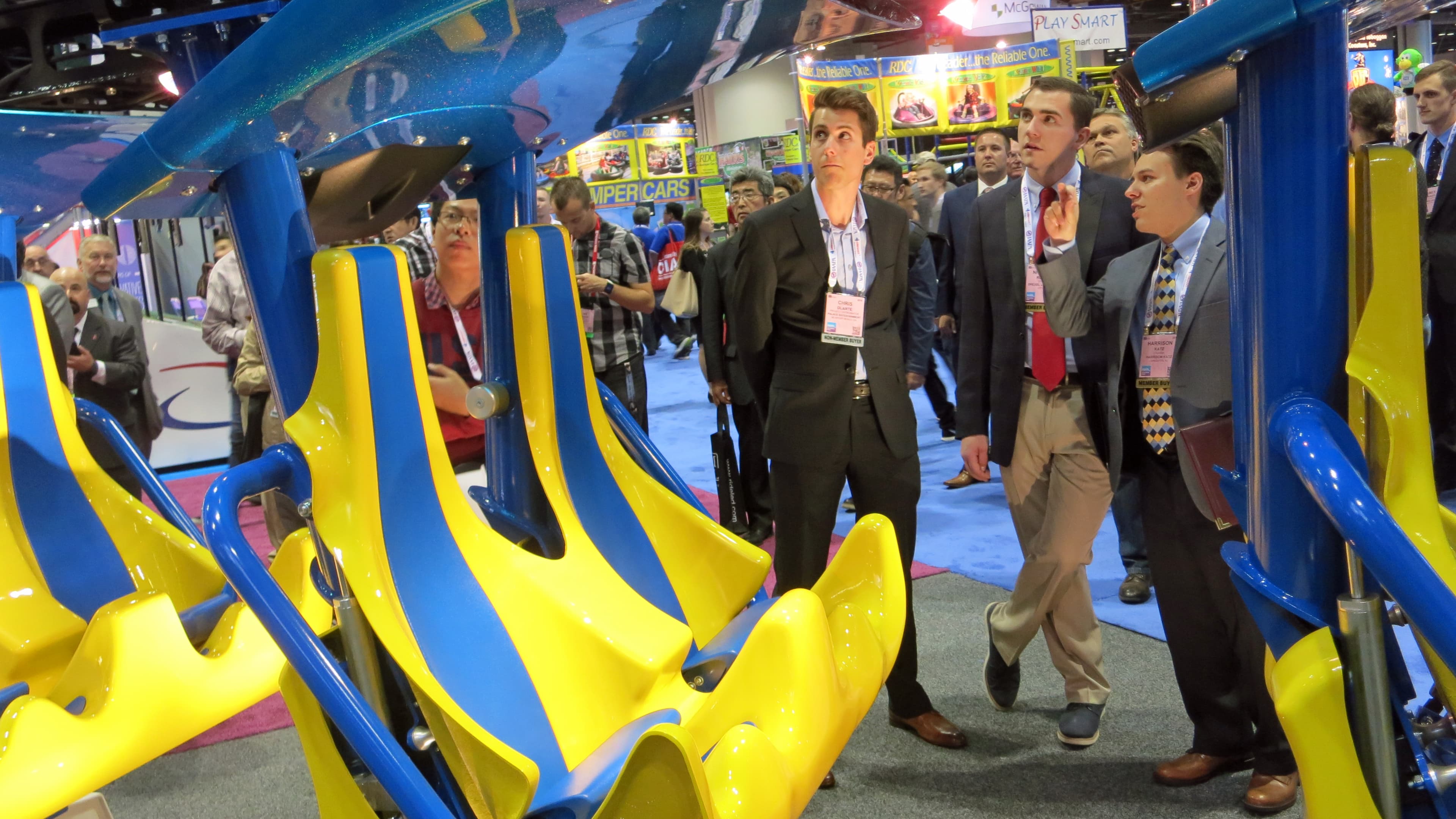 Park operators inspect the latest roller coaster designs at the IAAPA Expo in Orlando.