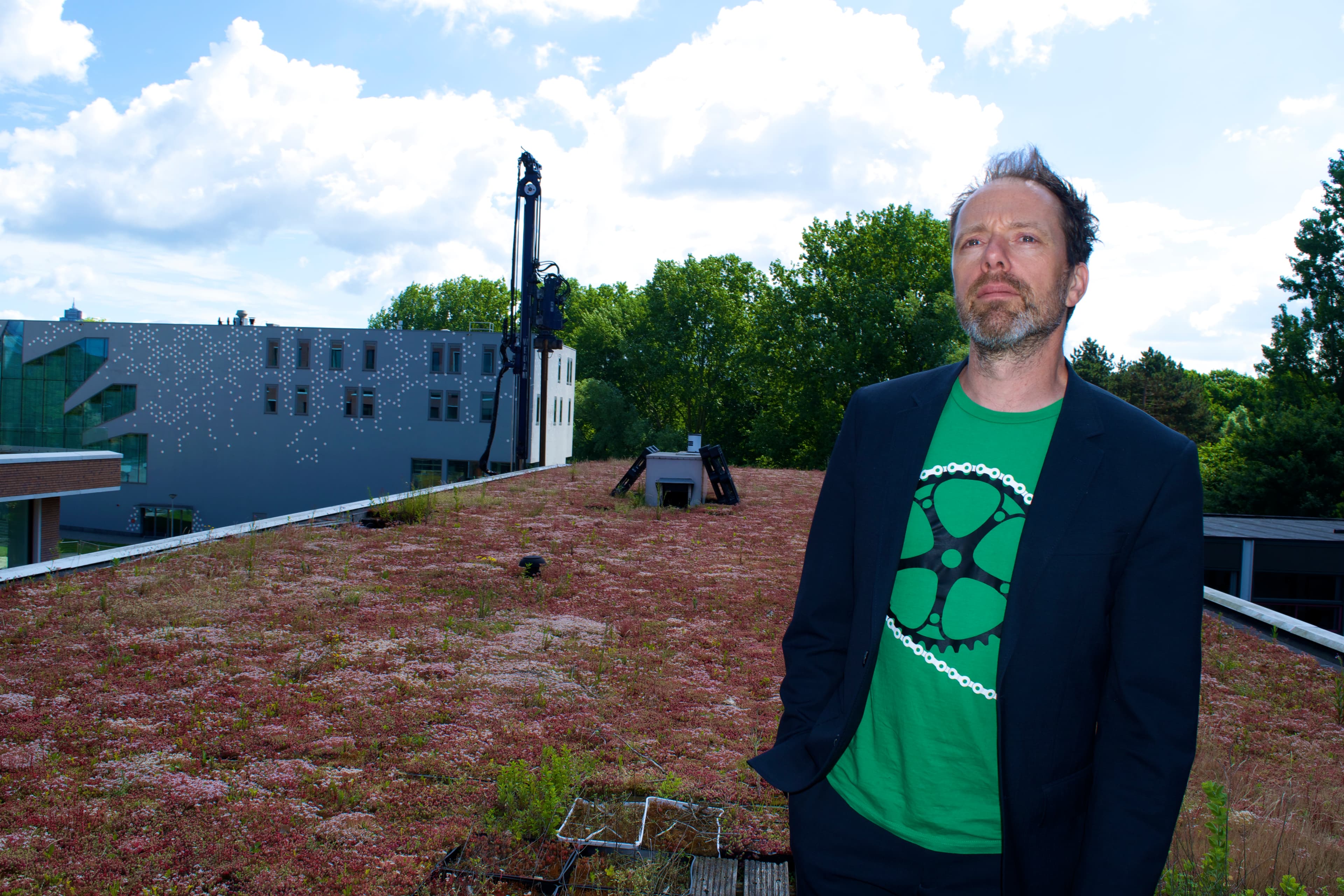 Daniel Goedblood of the Amsterdam Rainproof Project stands on a 