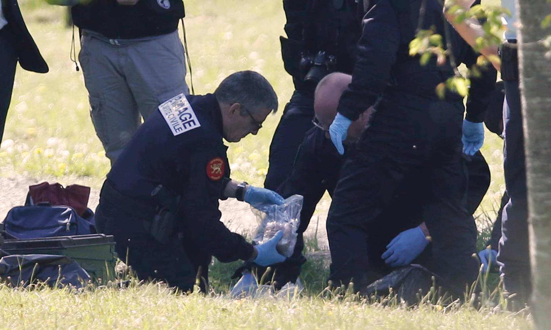 French police officers and bomb-disposal experts are seen during investigations in Saint-Pee-sur-Nivelle near Bayonne, France, after Basque separatist group ETA passed a list with the location of its arms caches to French authorities.