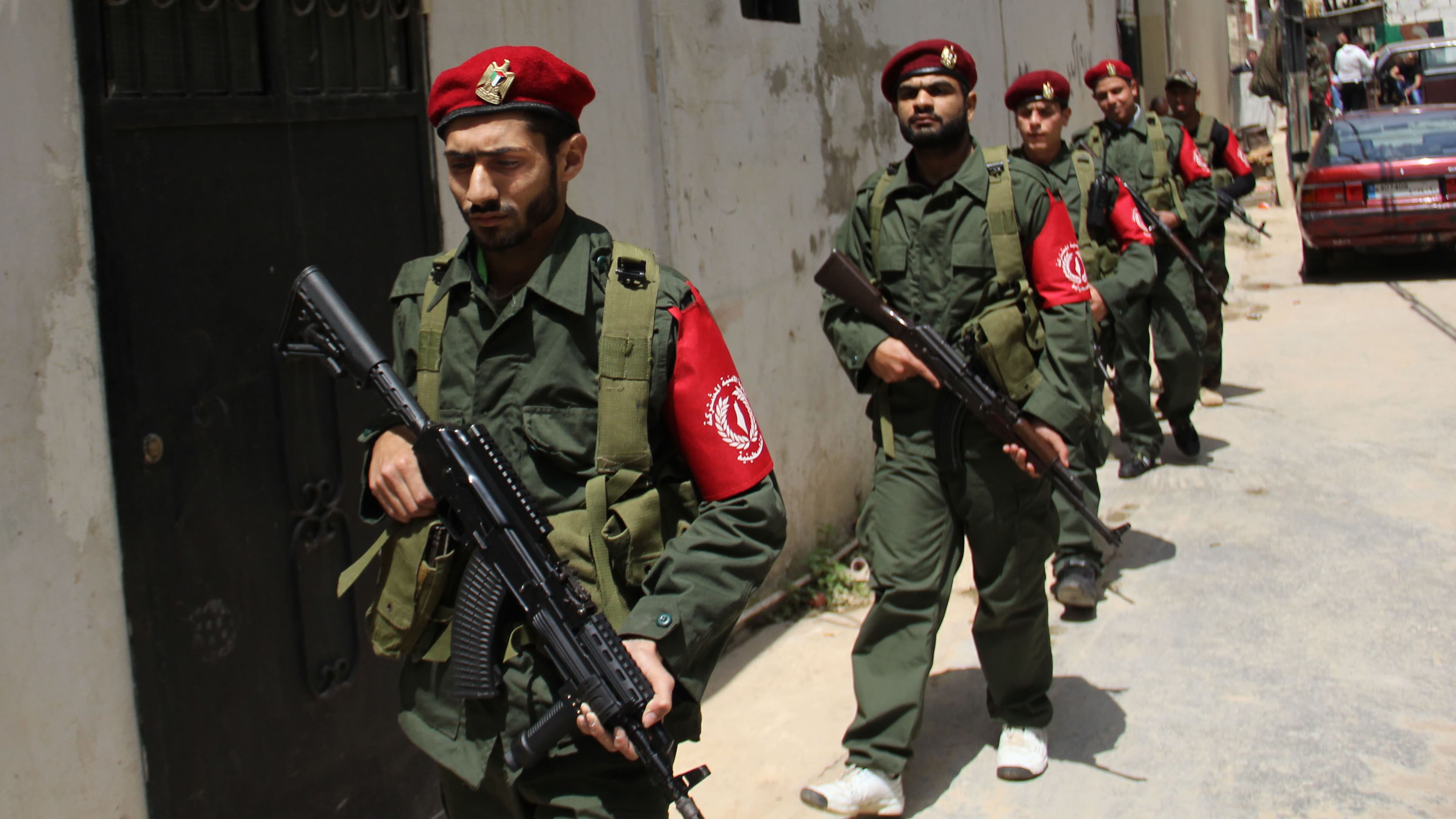 Mohammed Tassin Taher marches with his unit of the joint Palestinian police force.
