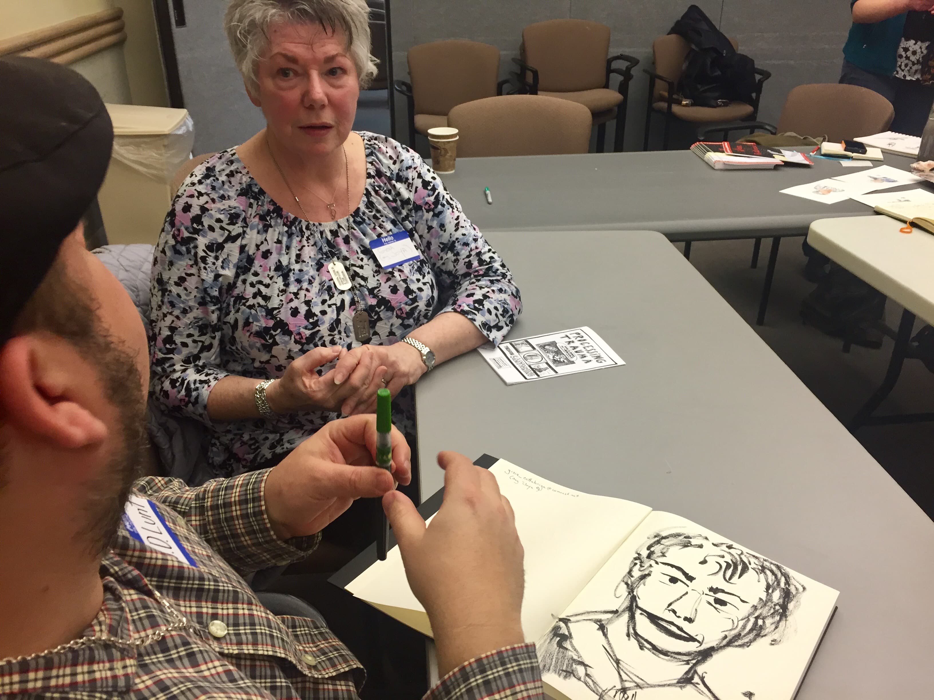 Cartoonist J.D. Lunt sketches veteran Gioia Cattabriga.