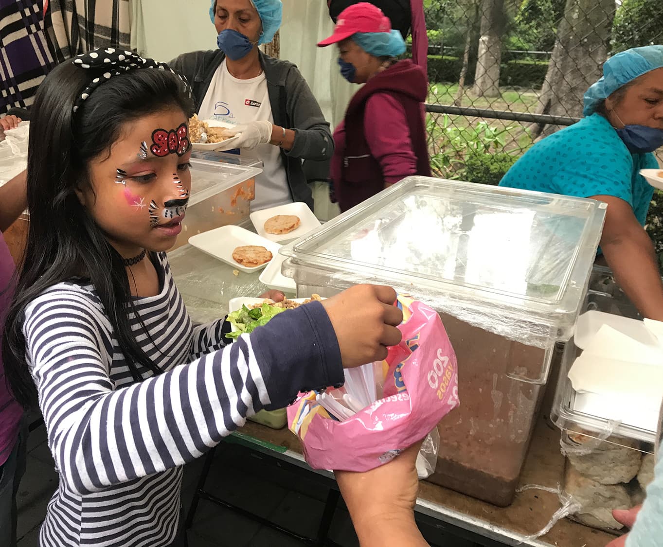 A girl gets a meal at the Cuauhtémoc shelter, following the Mexico City earthquake.