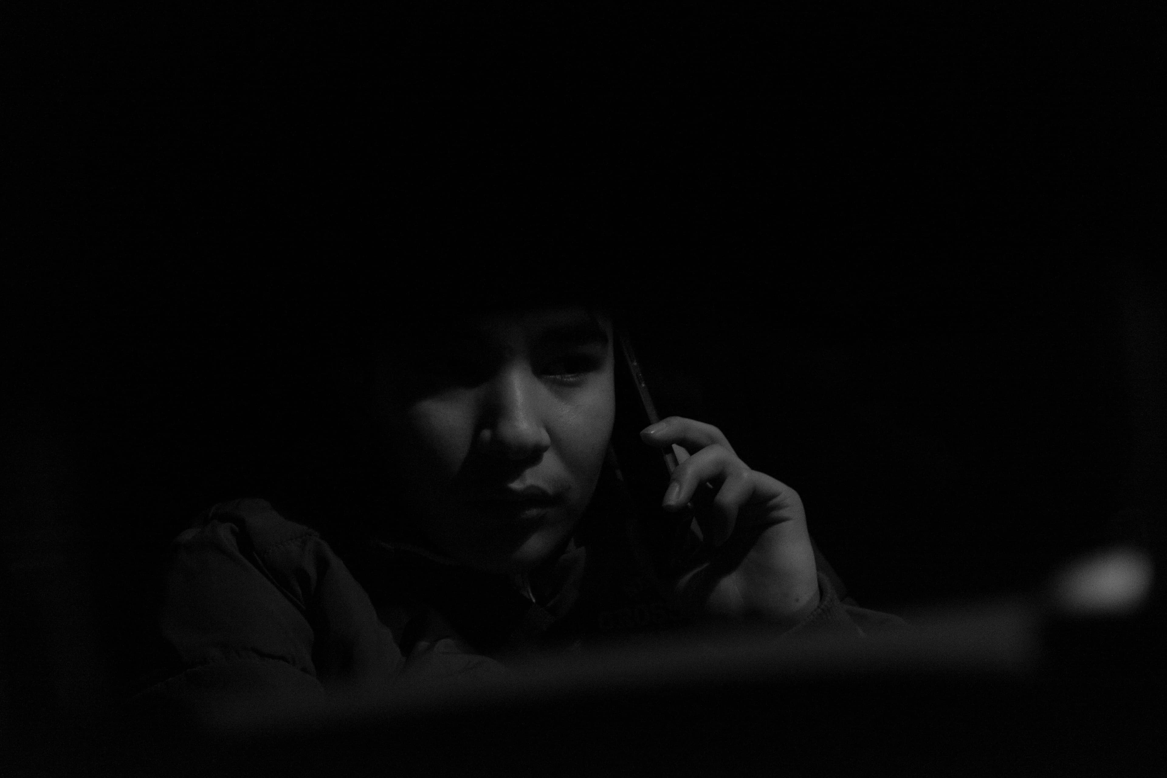 Hadi speaks to his mother on the phone.