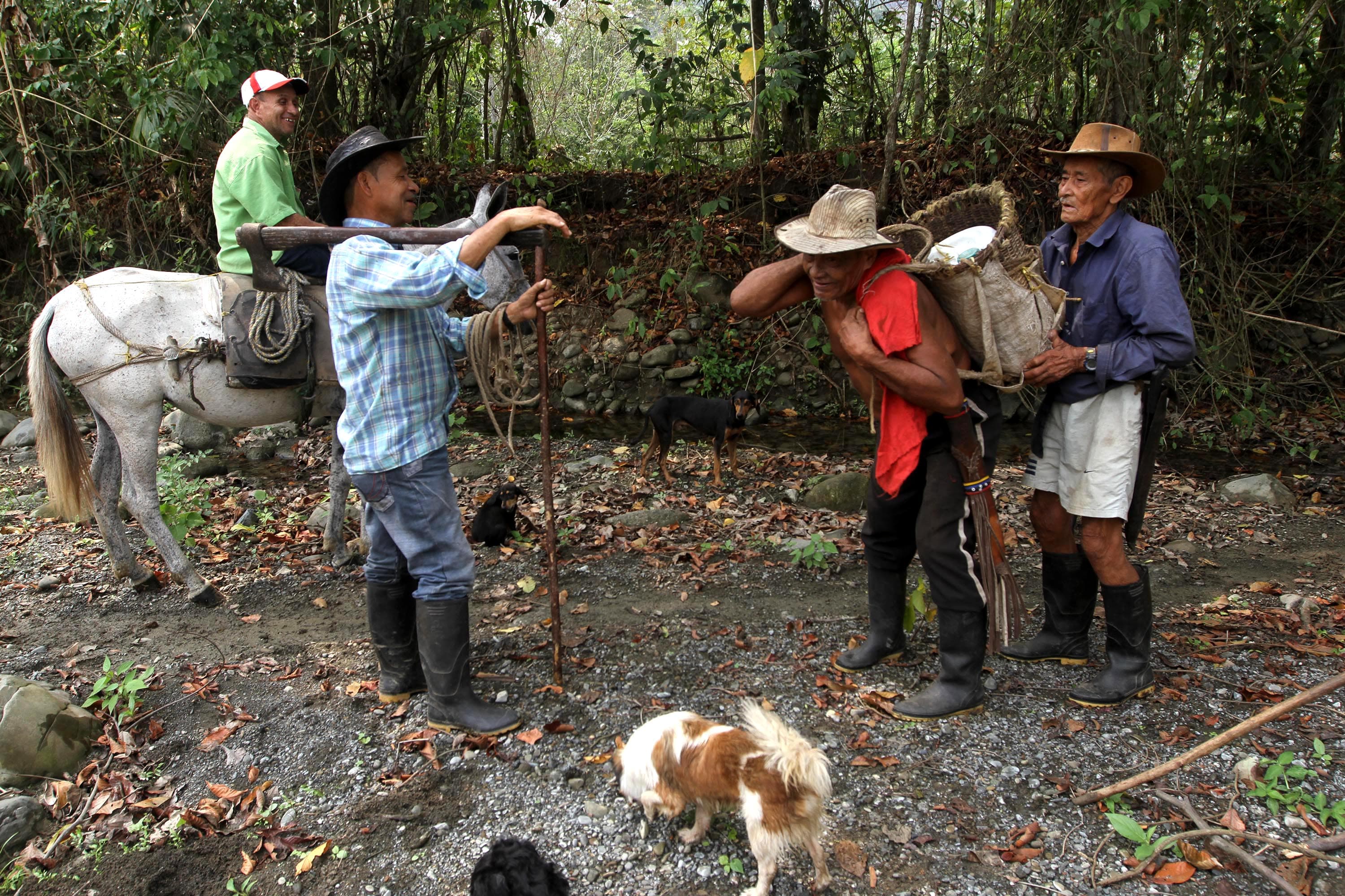 These are community elders carrying wood, supplies in preparation for 19th anniversary.