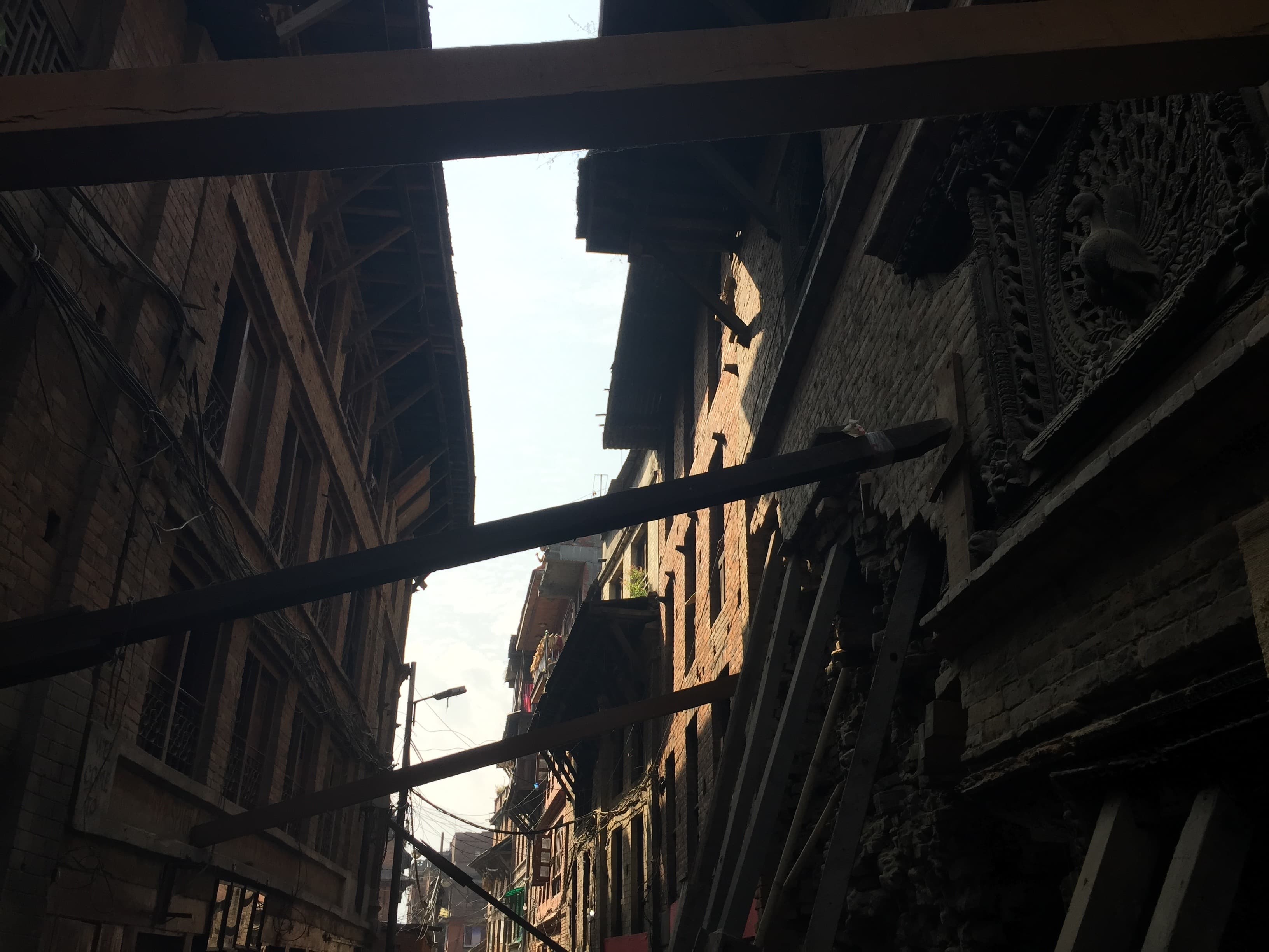 Earthquake-damaged buildings in the historic city of Bhaktapur. Nepalese officials want tourists to know the city is ready for visitors.