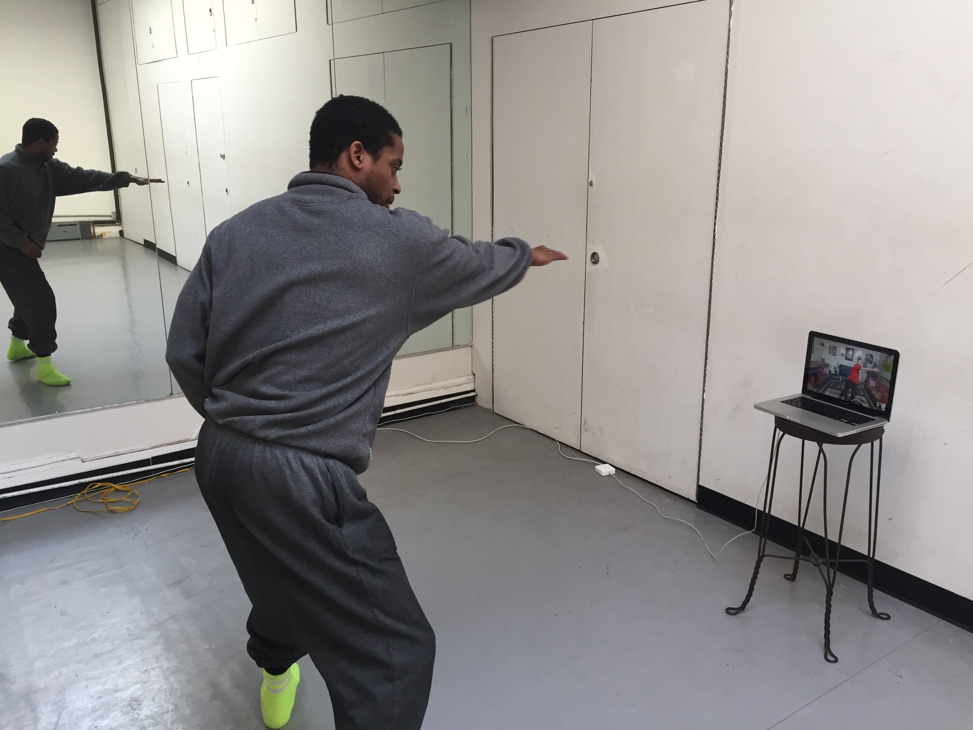 Sean Scantlebury in New York gives a dance lesson to Aadel Qies in Baghdad