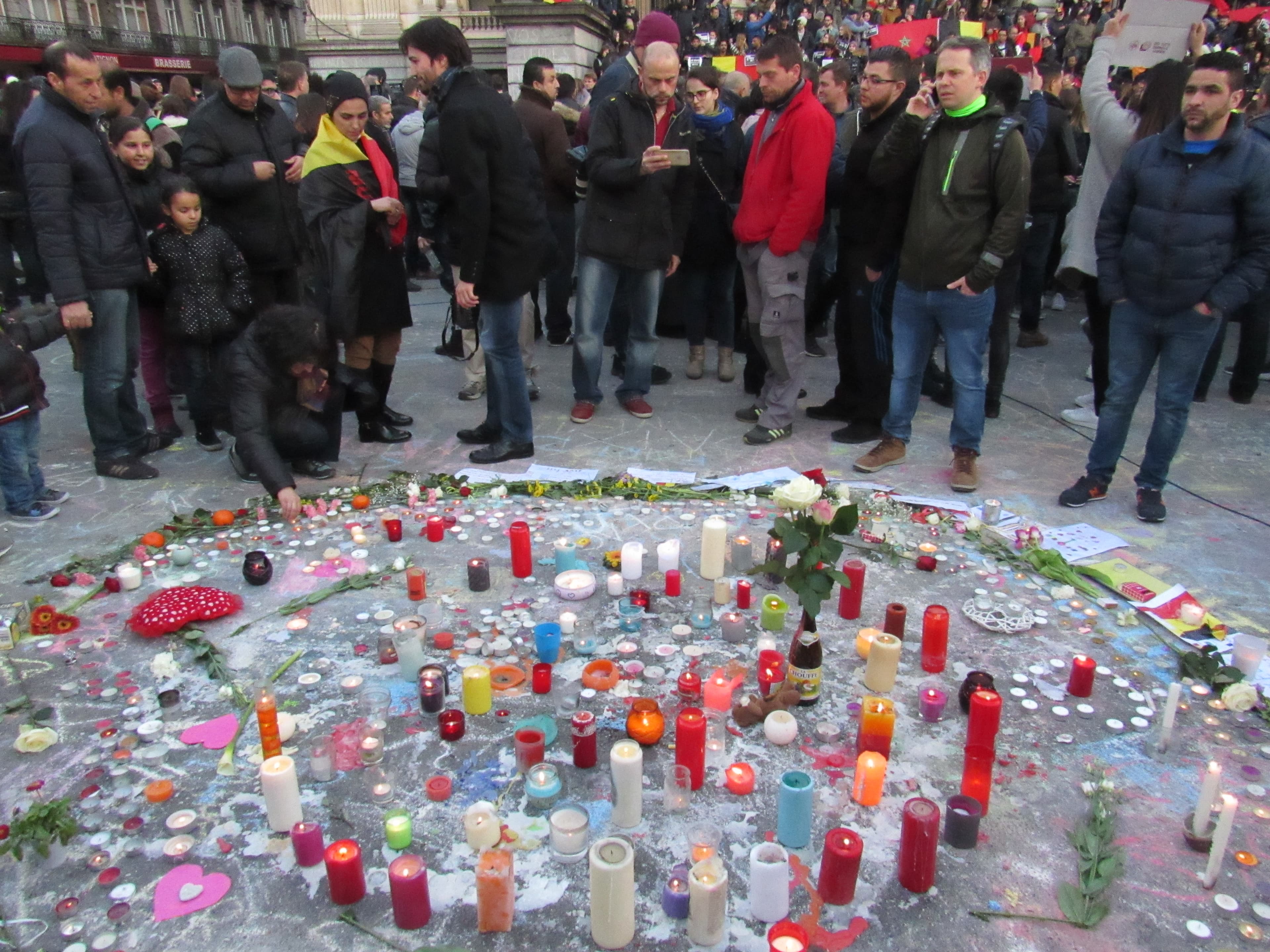 Candles are lit in memory of the victims of the Brussels attacks.