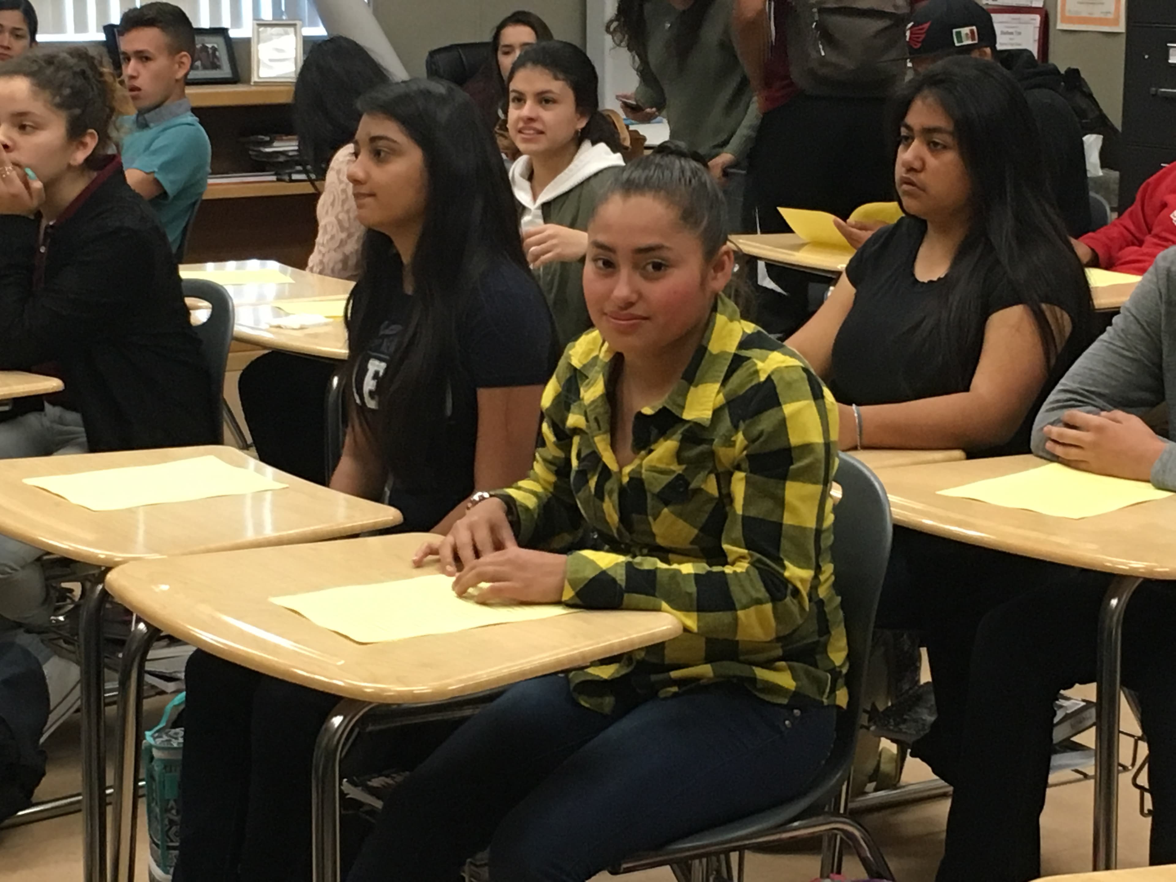 Girl in classroom sitting at desk