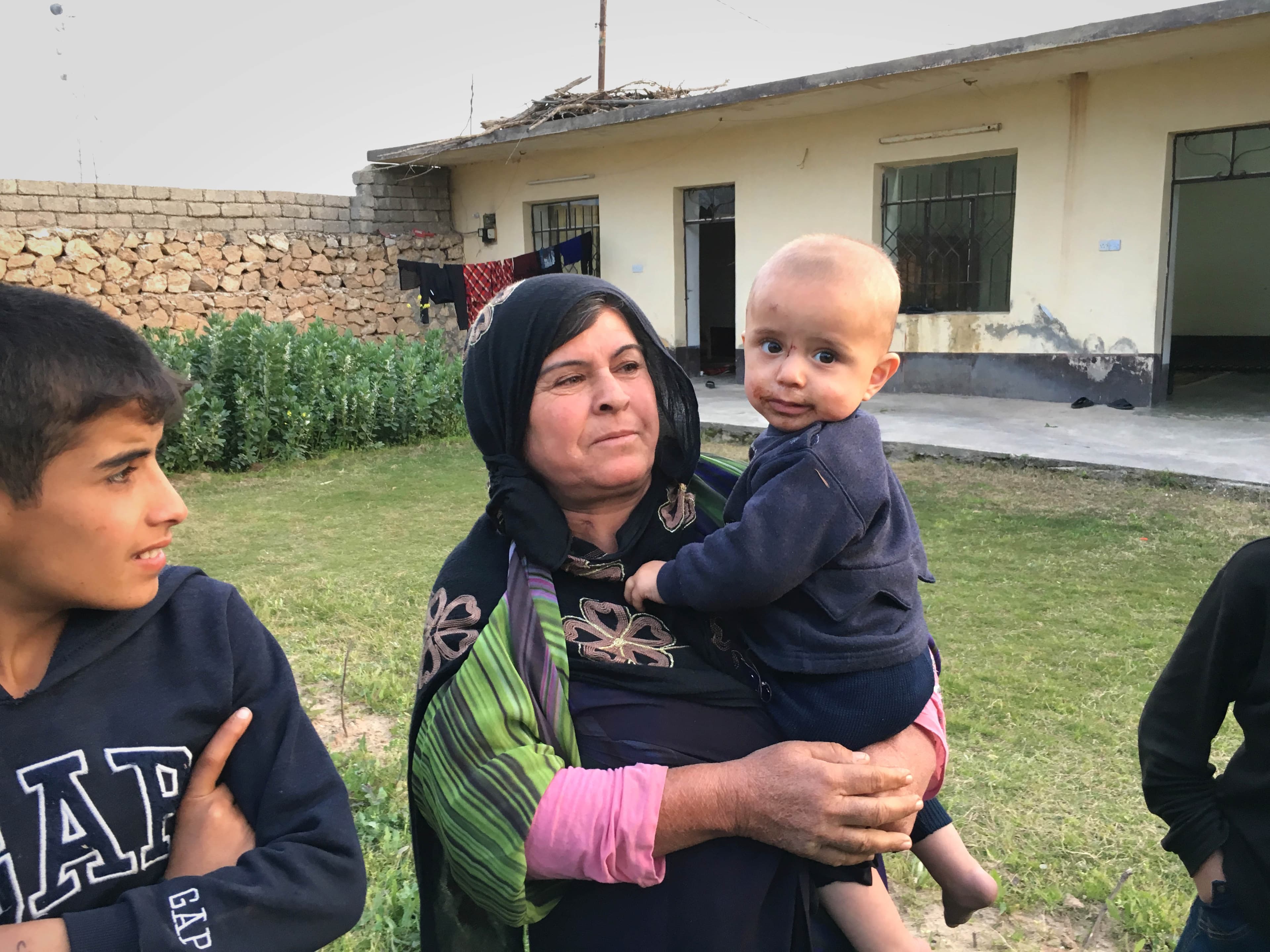 Amina Mohammed outside her home in Wana downstream of the Mosul Dam, which engineers warn is in danger of bursting.