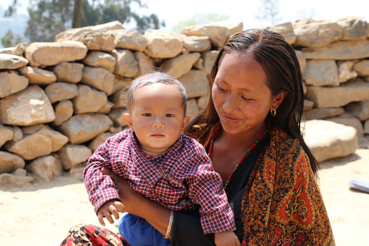 Ayushma Lama, 22, plays with her 7-month-old son Yashu.