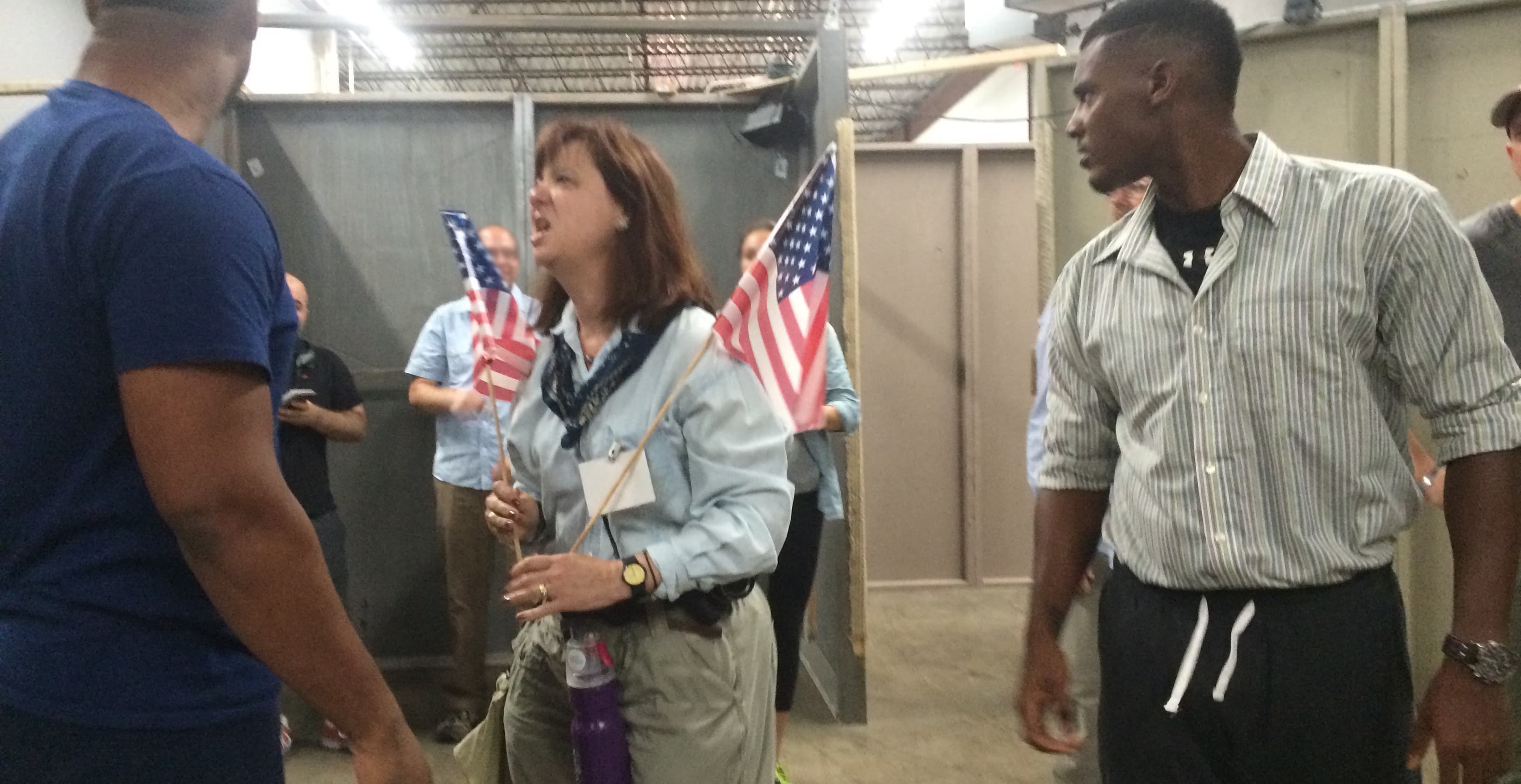 Actors simulate a Donald Trump rally during which supporters become aggressive toward reporters.