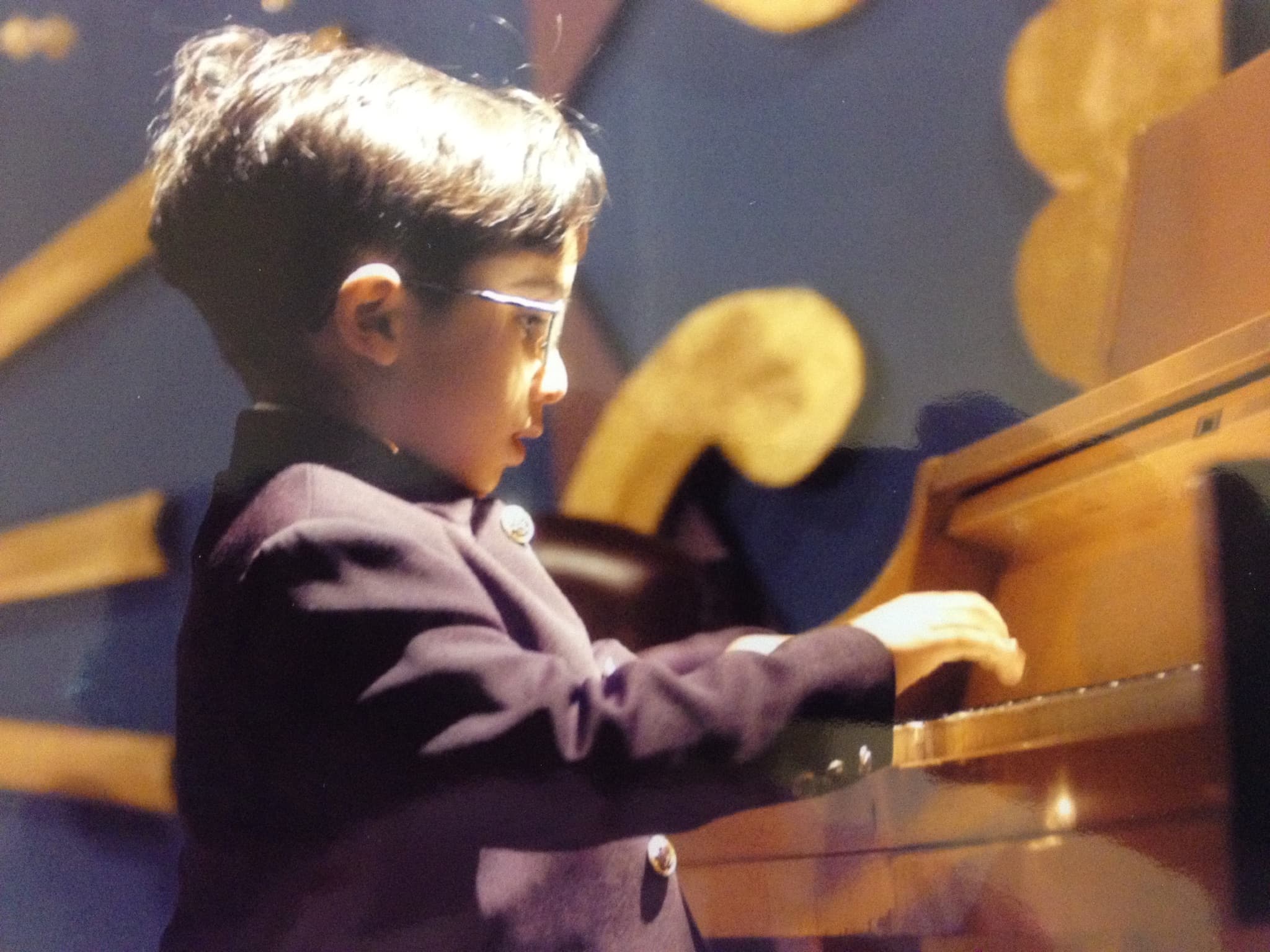 Four-year-old Amir Darabi on stage in Tehran.