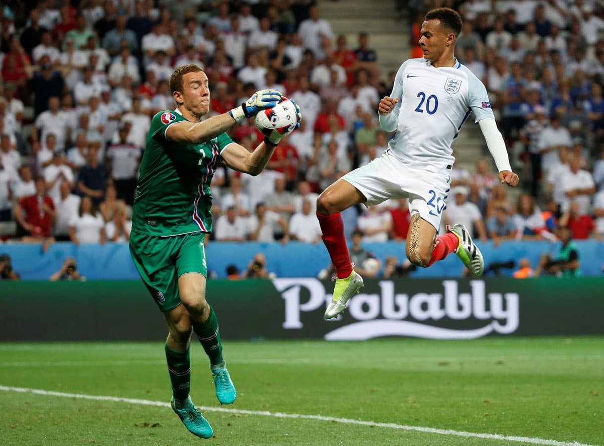 England's Dele Alli in action with Iceland's Hannes Halldorsson.