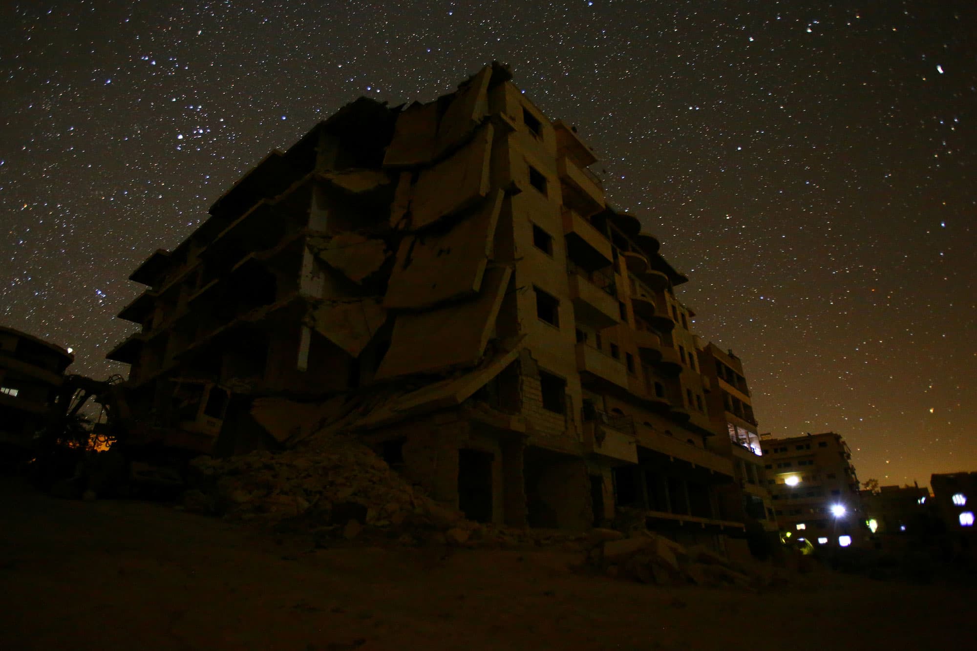 Damaged buildings stand in the rebel-controlled area of Maaret al-Numan in Idlib province.
