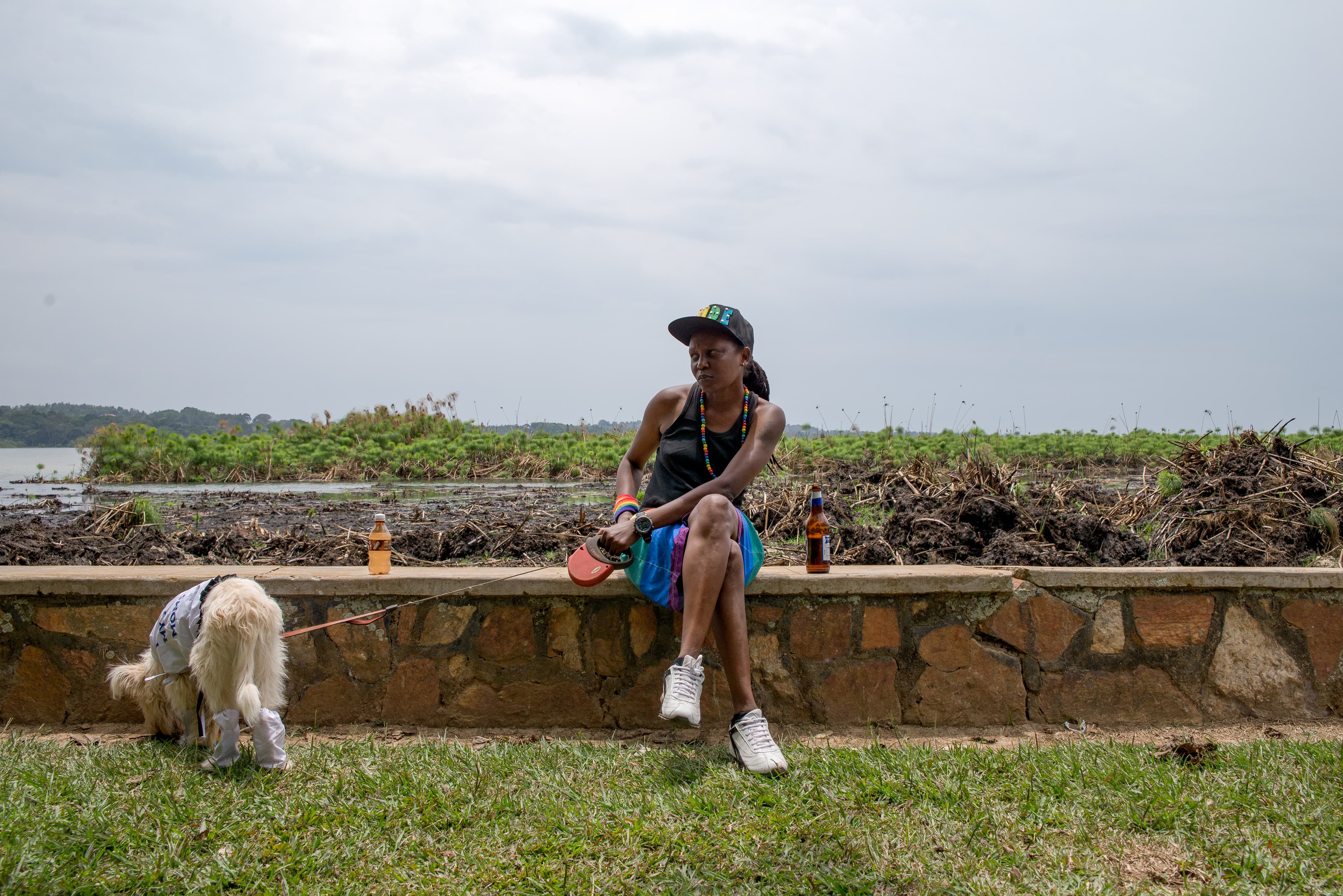 Kasha Nabagesera watches as police disperse a crowd