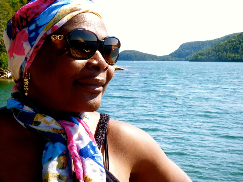 Woman on water looks out