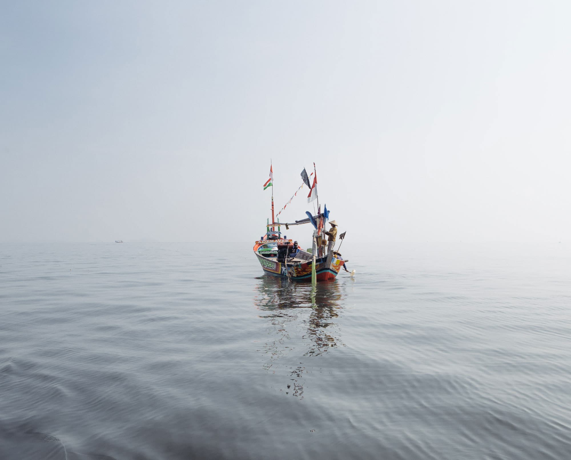 Fishermen in Jakarta Bay. Many fishermen here fear their livelihoods will be disrupted by the government's new plan to buffer the bay from the effects of sea level rise.