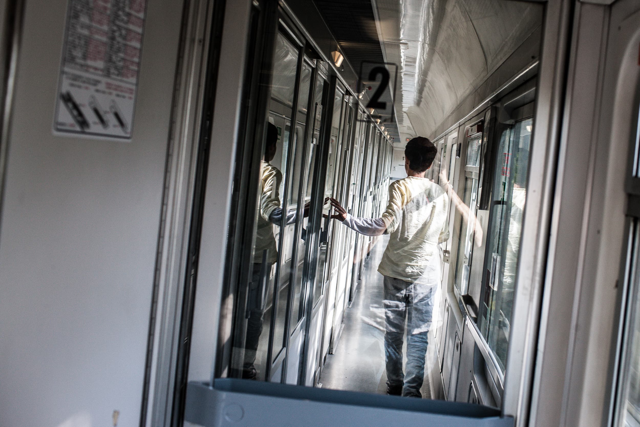 Syrian Asylum seeker Nawras Soukhta aboard a train in Italy.