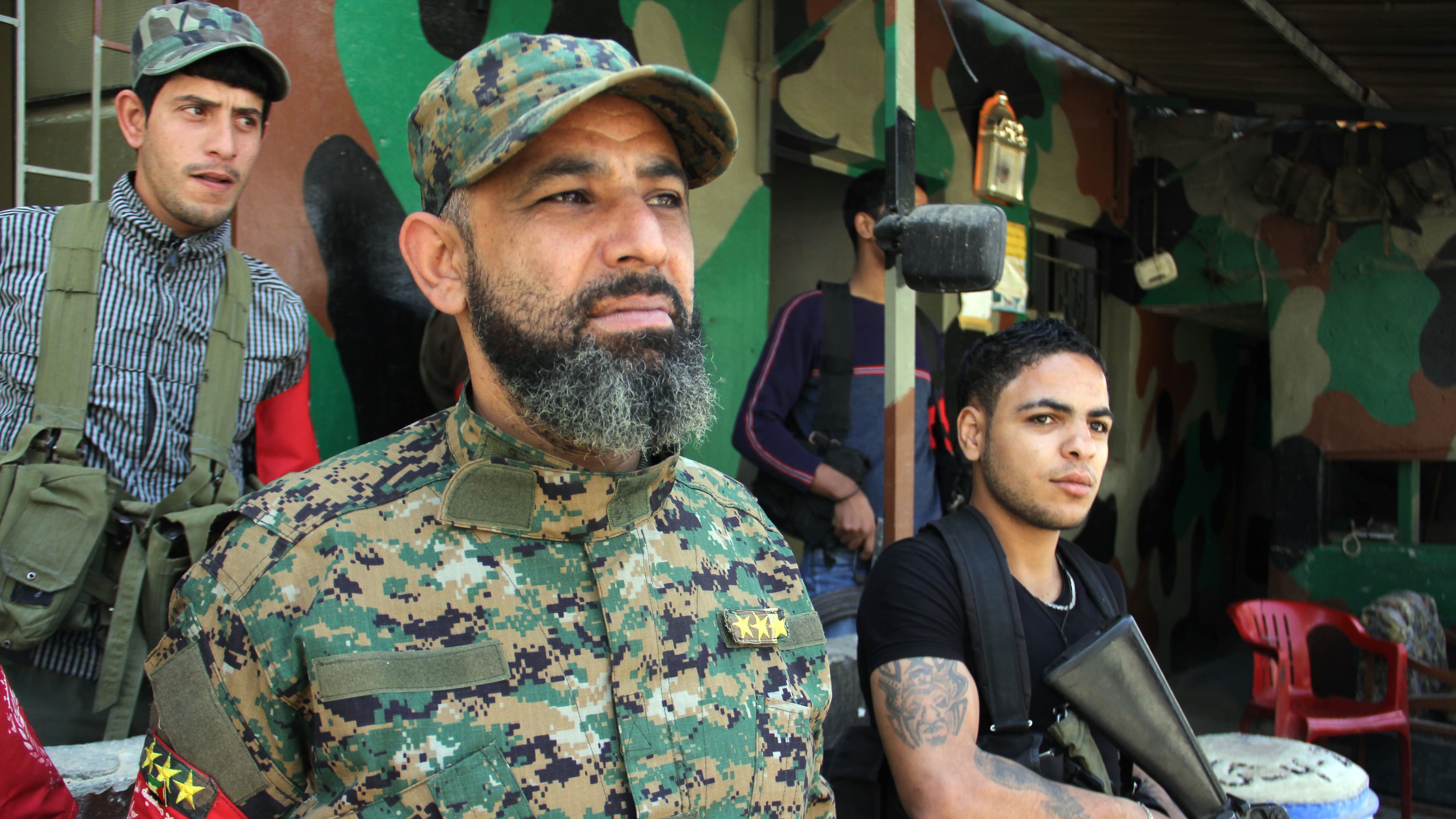 A unit commander who calls himself Magnum stands outside an office of the new Palestinian joint security force in Lebanon's Ain el-Helweh refugee camp.