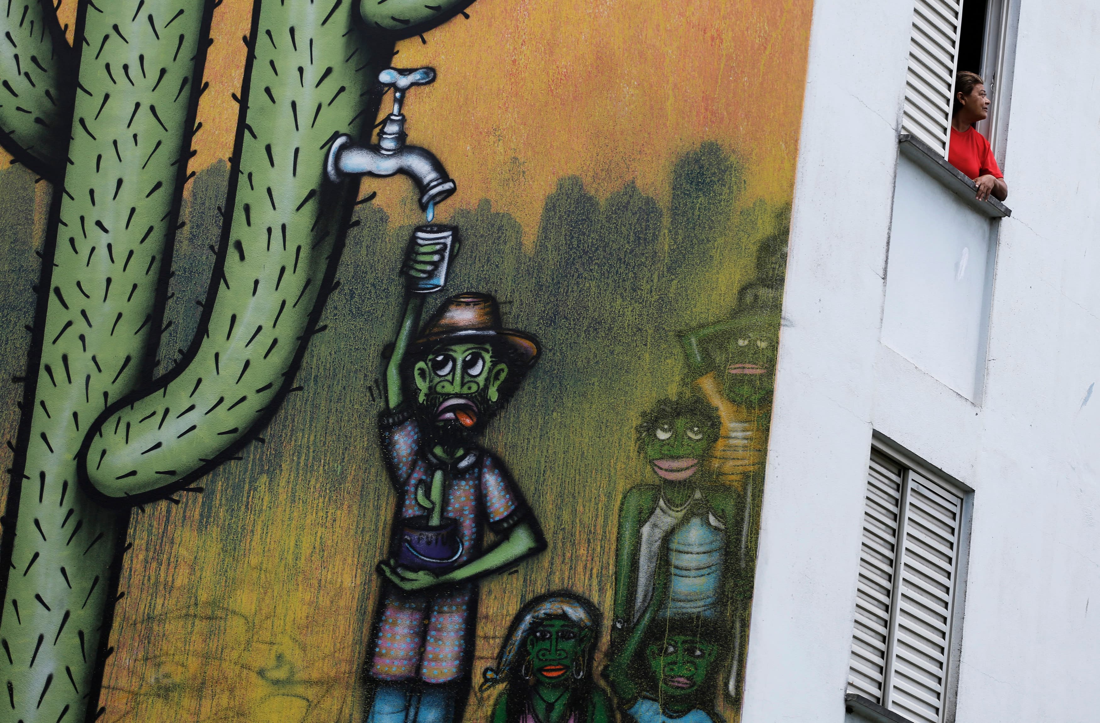 A mural by by Brazilian artist Mundano is one of many around São Paulo commenting on the city's water crisis. Reservoir levels are still below 20 percent of capacity heading into the region's dry season.