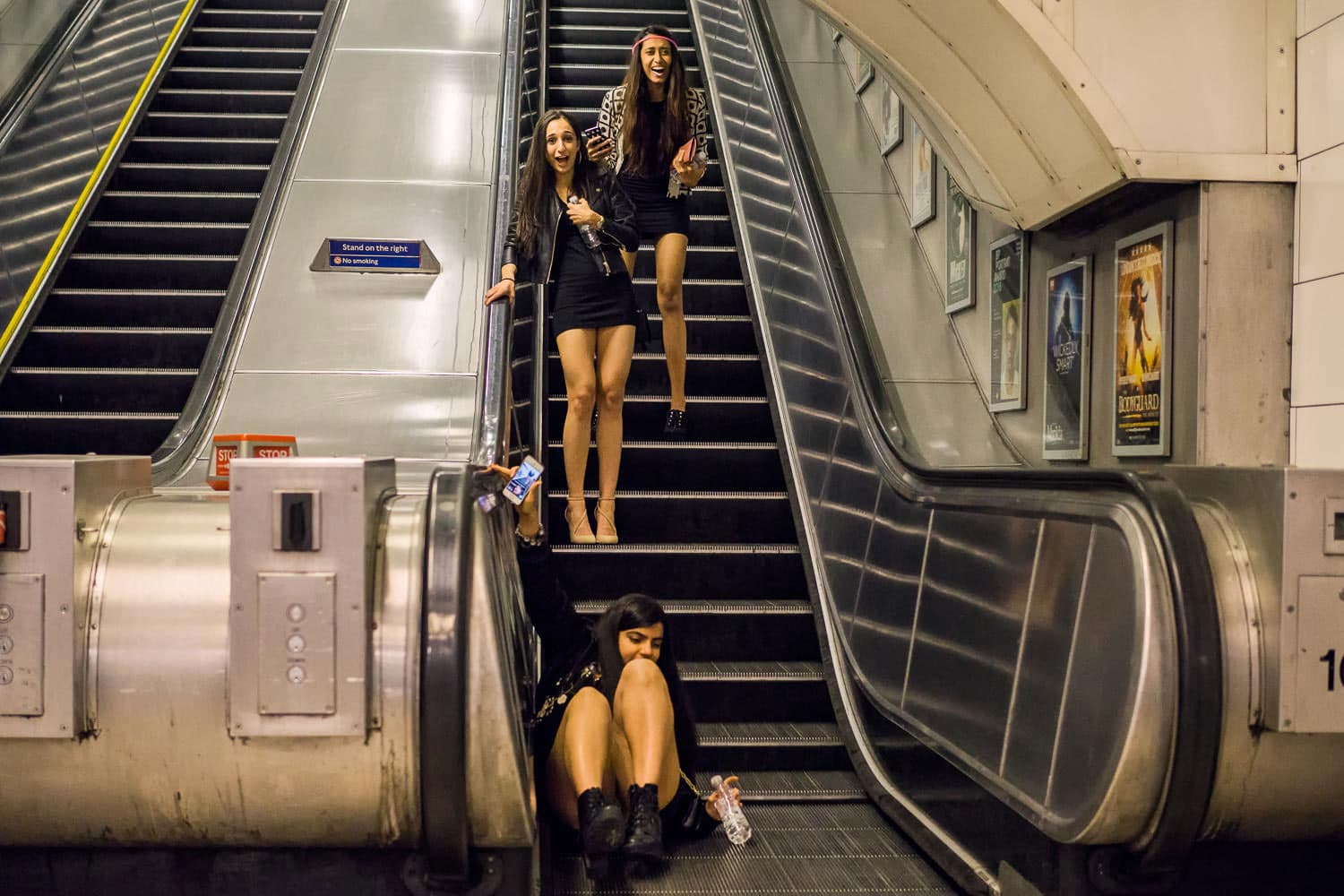 It was quiet down the labyrinth like corridors of Oxford Circus in the early hours until the sound of giggling girls rang down from the escalators. Immediately heading to the foot of the stairwell as well as a lone cameraman we simultaneously captured thi