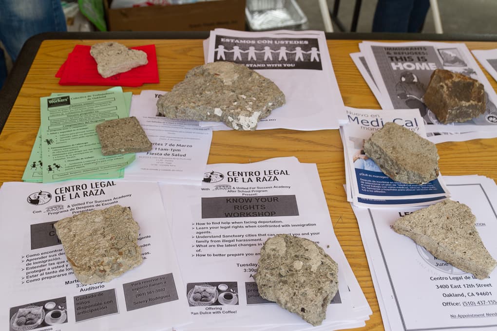 Table with papers held down by rocks