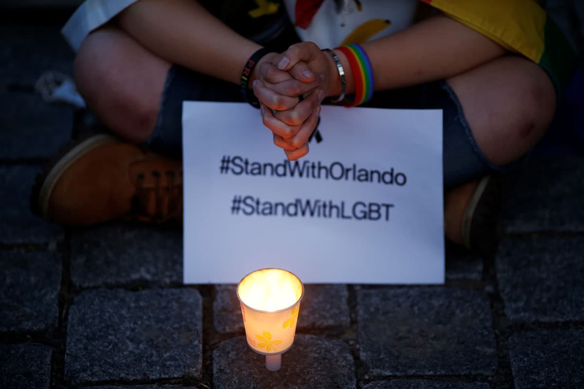 A woman prays during a candlelight vigil in Seoul, South Korea.